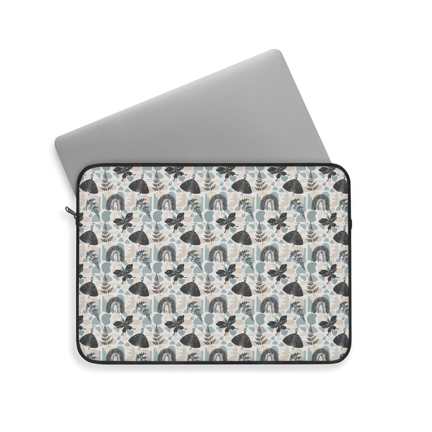 A cute boho chic style laptop sleeve with rainbows, plant leaves, and butterflies design.