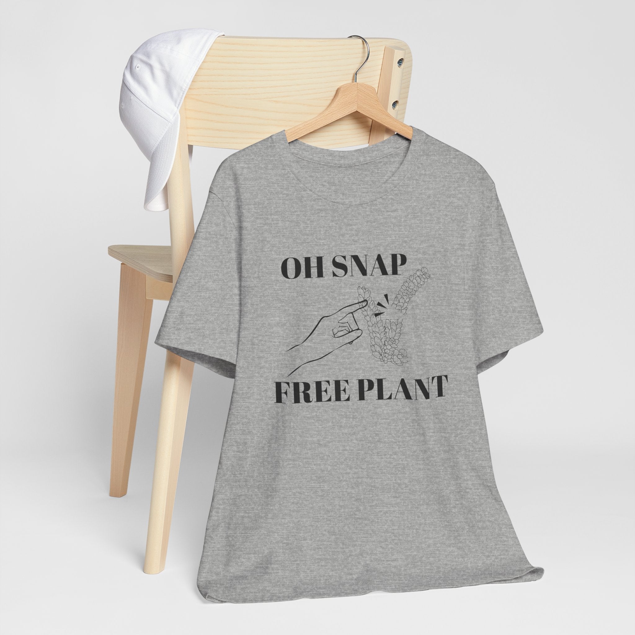 A funny t-shirt with an "OH SNAP FREE PLANT" design. There is also a lady's hand pointing to a burro's tail plant snapped in half. An excellent gift for people who like plants and people who collect plants.