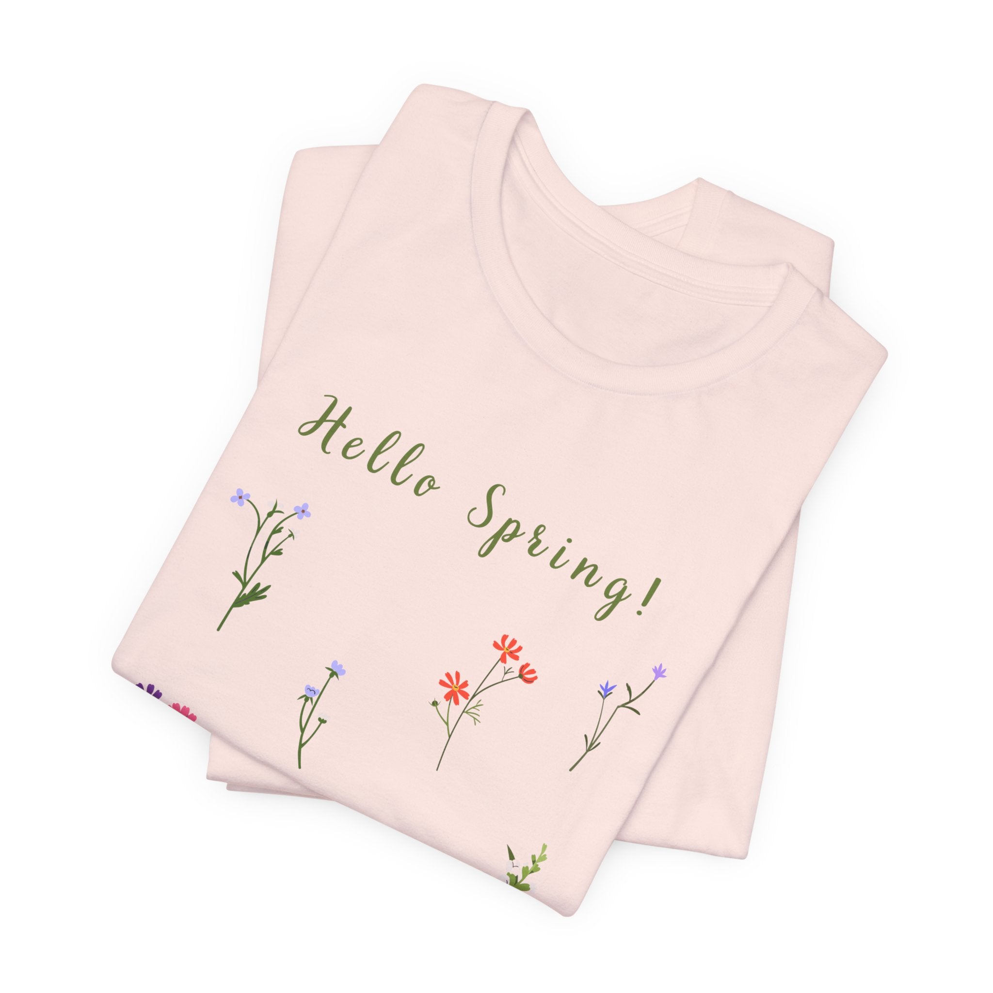 a folded t-shirt with the words "Hello Spring!"