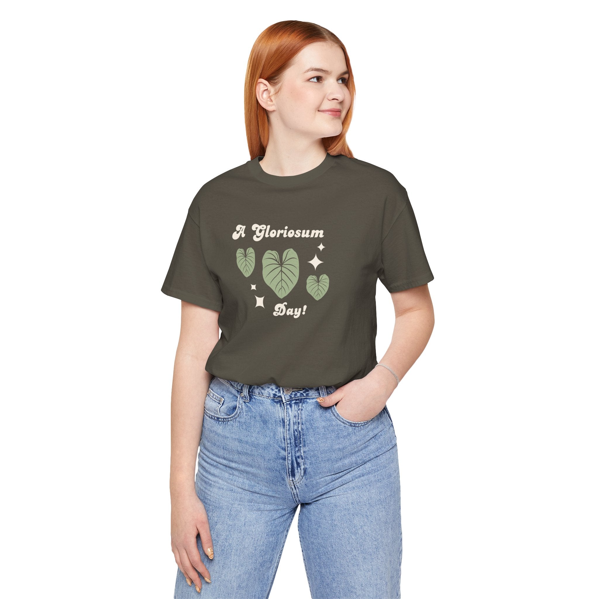 a woman wearing a "philodendron gloriosum day!" plant t-shirt