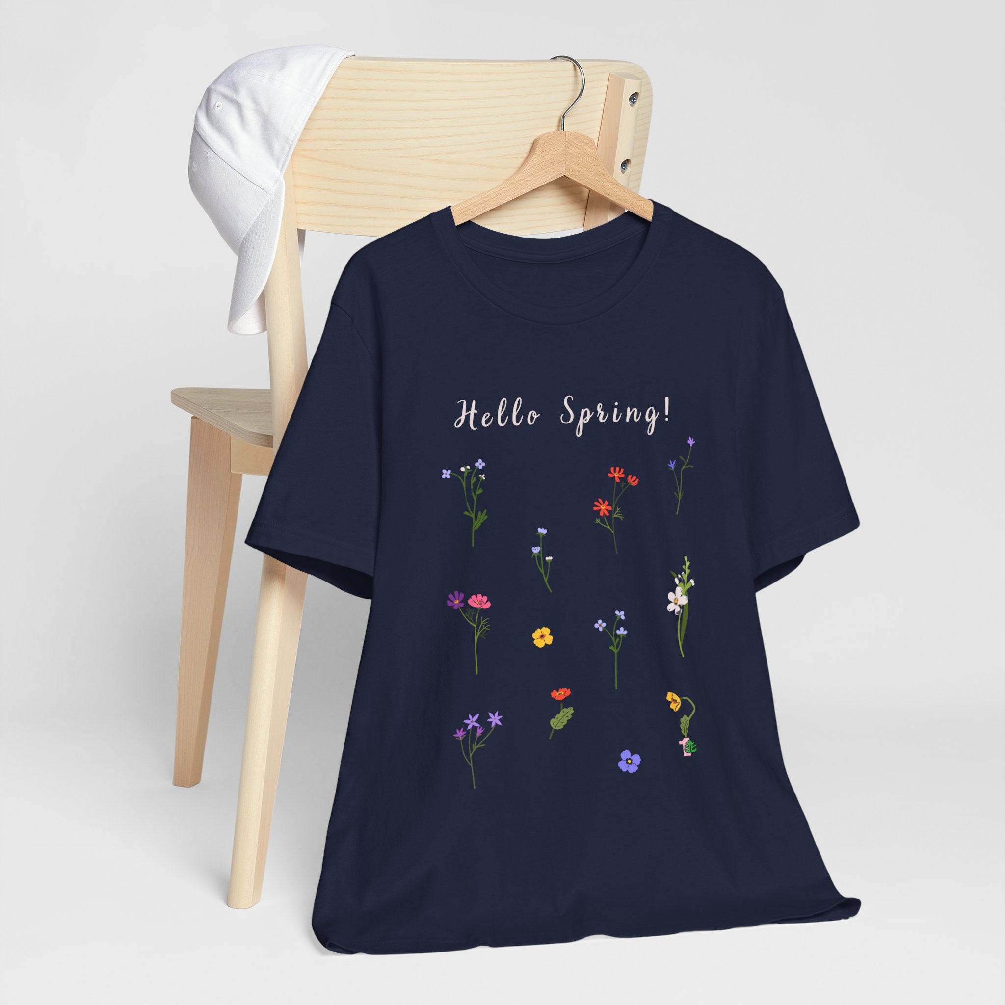 A navy shirt with the words "Hello Spring!"