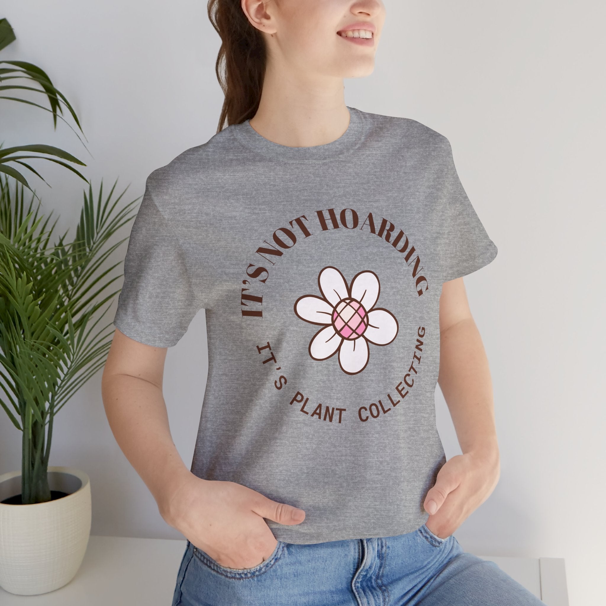 a woman wearing a tee with text that says "It's not hoarding, it's plant collecting"