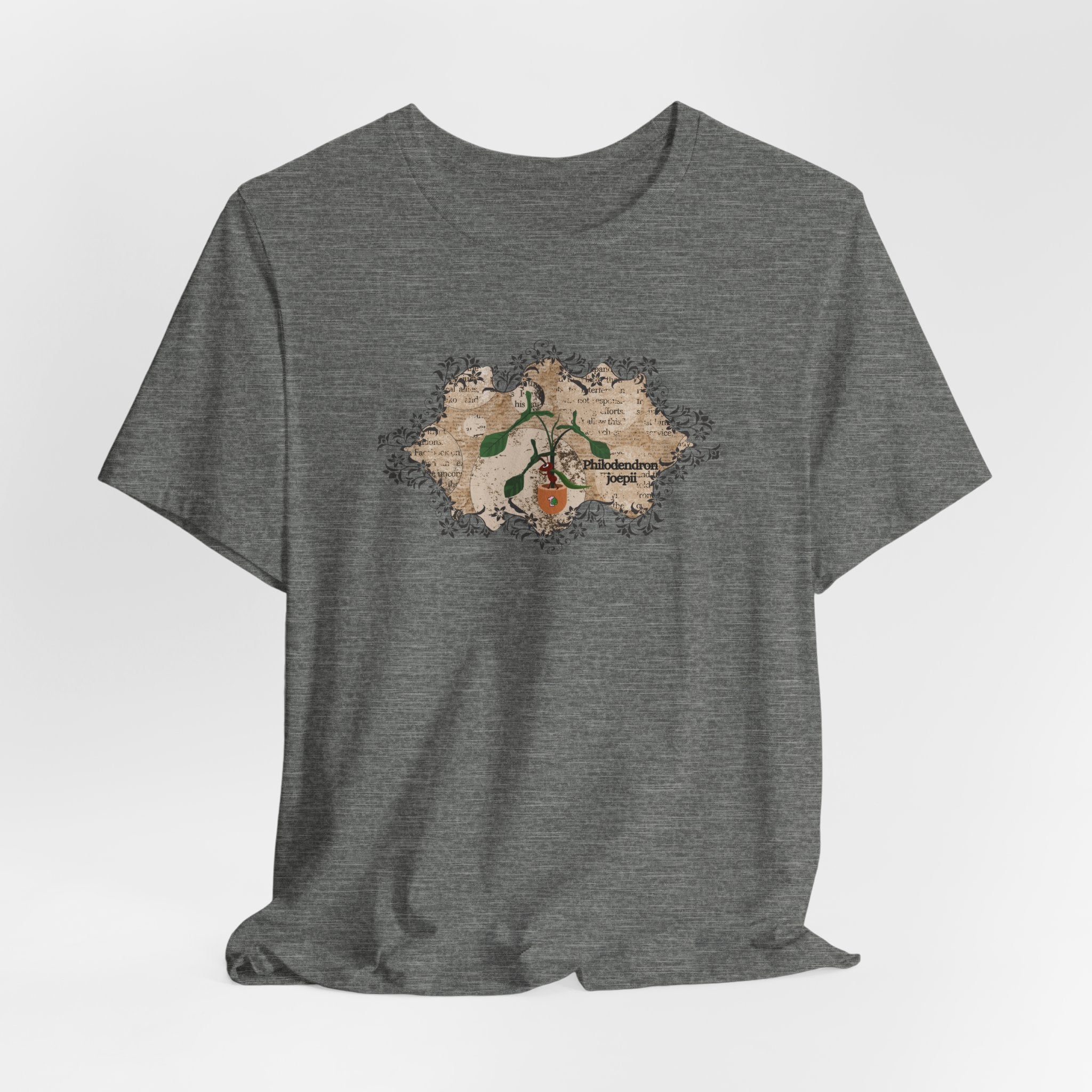 A light weight plant t-shirt with a philodendron plant design. The philodendron joepii is printed on the t-shirt along with an ant eating the plant leaves.