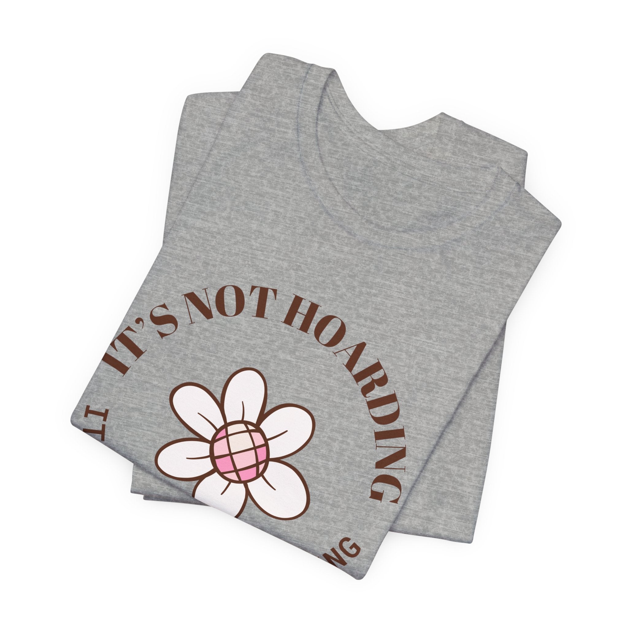 a folded t-shirt with text that says "It's not hoarding, it's plant collecting."  The perfect gift for plant collectors, plant lovers, or plant enthusiasts.