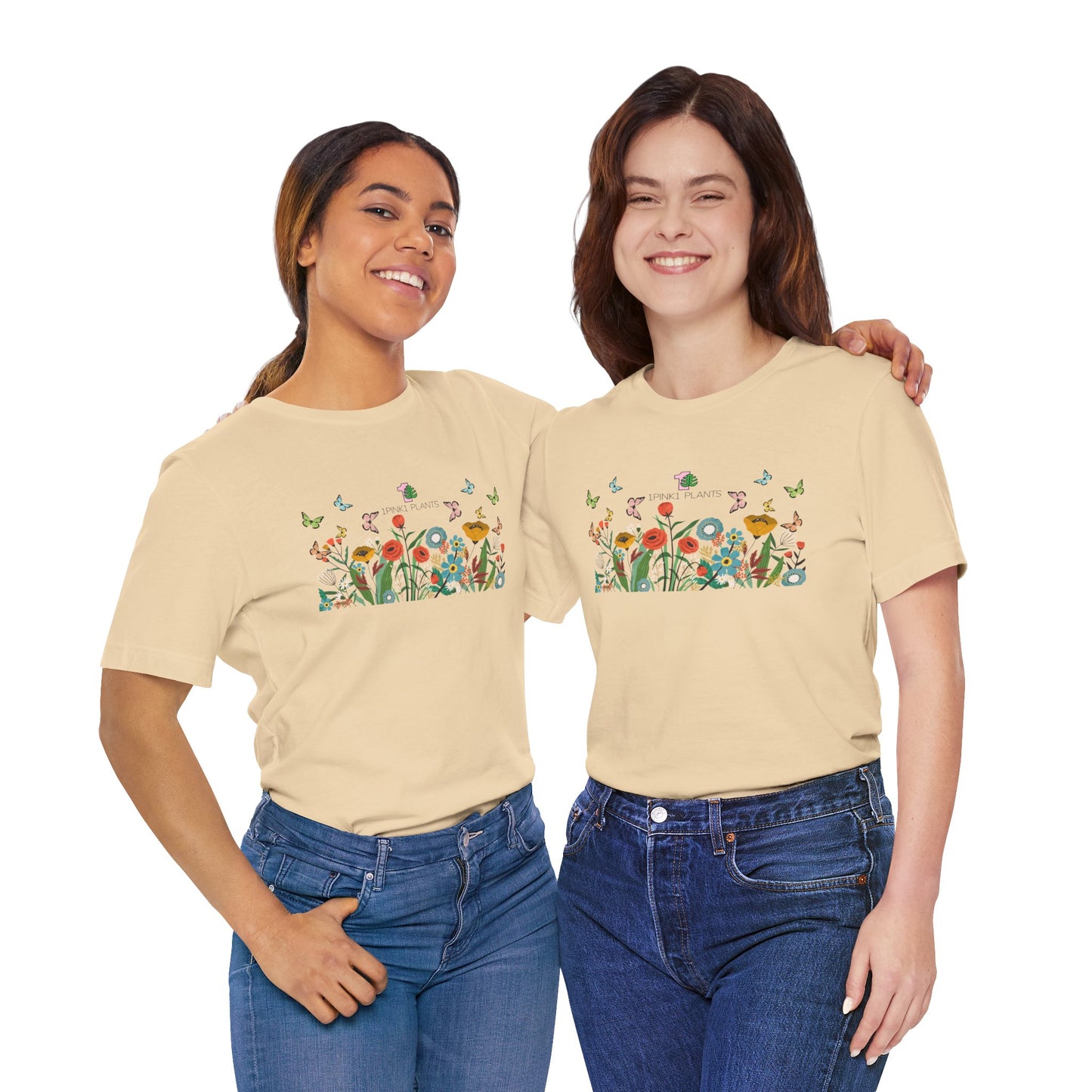 Two ladies wearing a garden shirt with flowers and butterflies