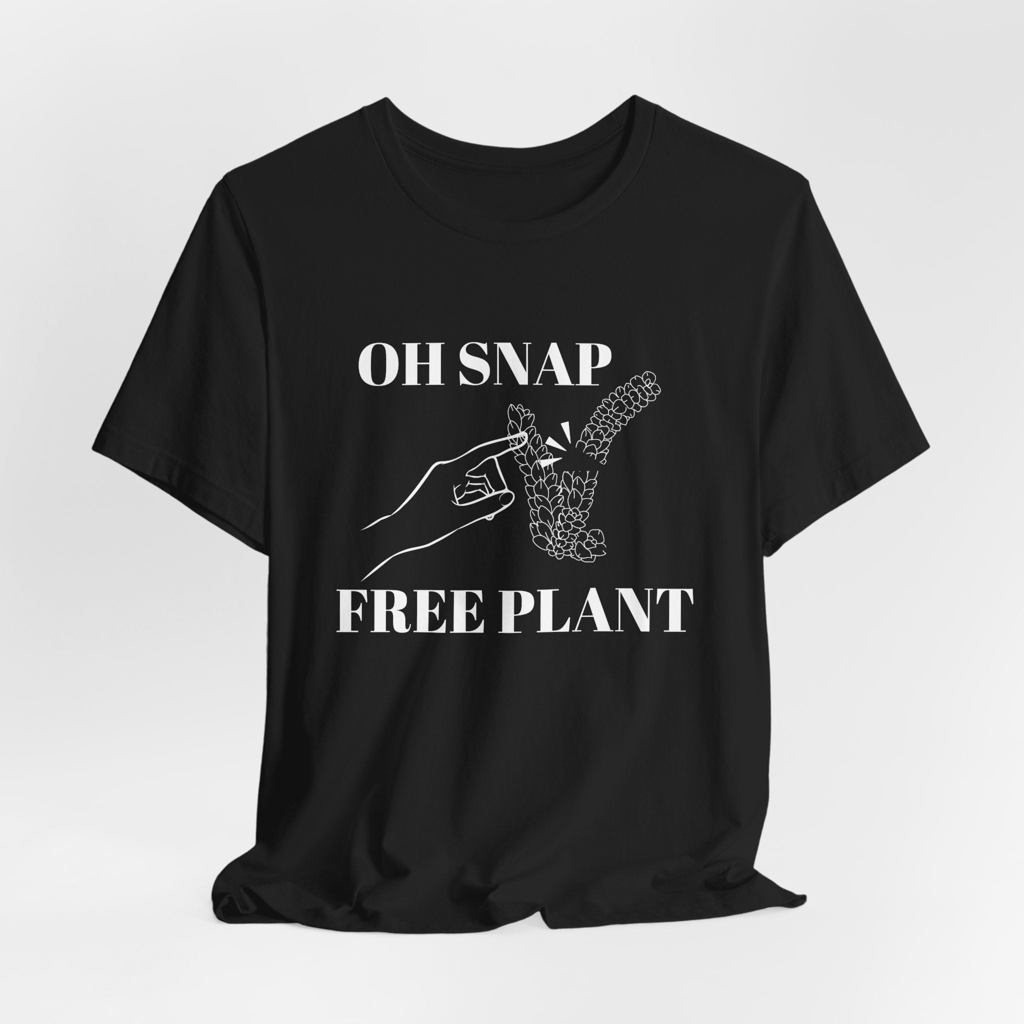 A black colored shirt with text that says "Oh snap" "free plant."  The shirt design also has a burro's tail plant snapped in half and a finger pointing to it. The shirt is an excellent gift for birthdays and Christmas. House plant collectors love this funny t-shirt.