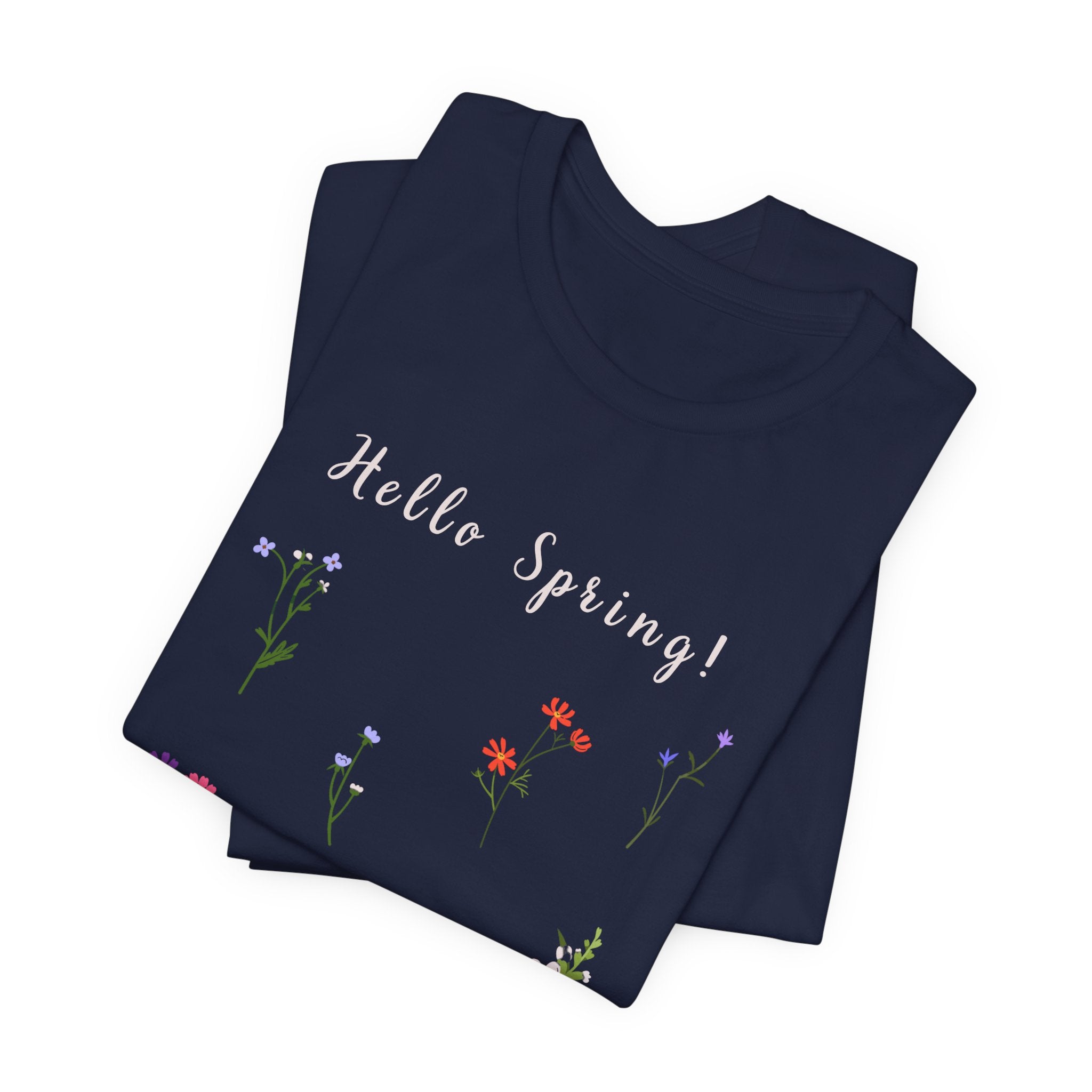 a folded navy t-shirt with the words "Hello Spring!"