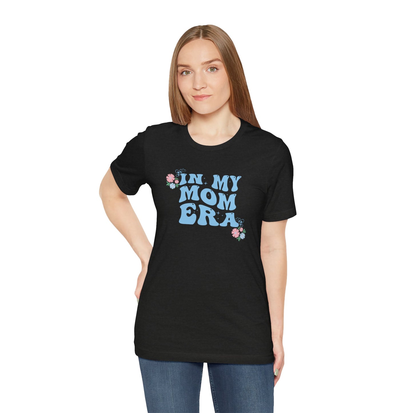 A person wearing a shirt with the words "In my mom era" printed in blue. This t-shirt makes an excellent gift for a baby shower.