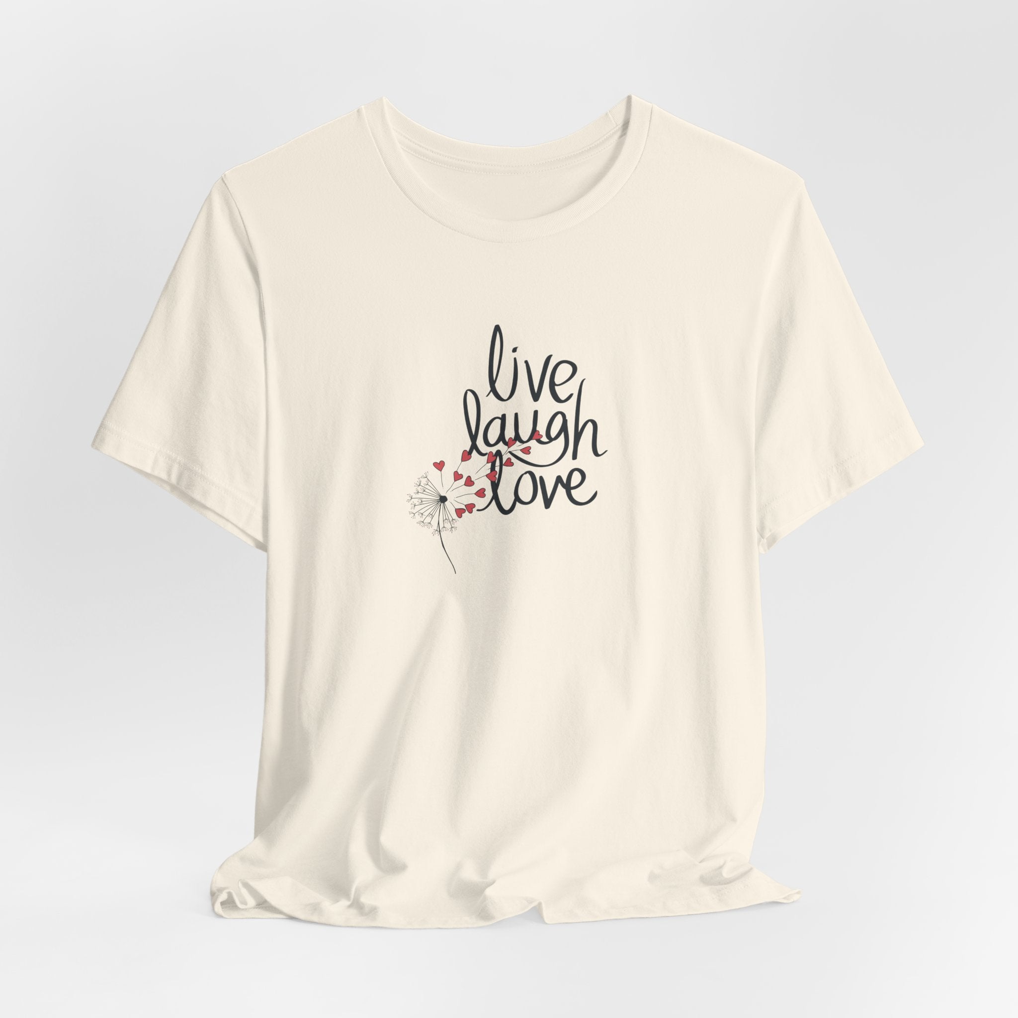 a tee shirt with the text that says live, laugh, love, and a dandelion with hearts.