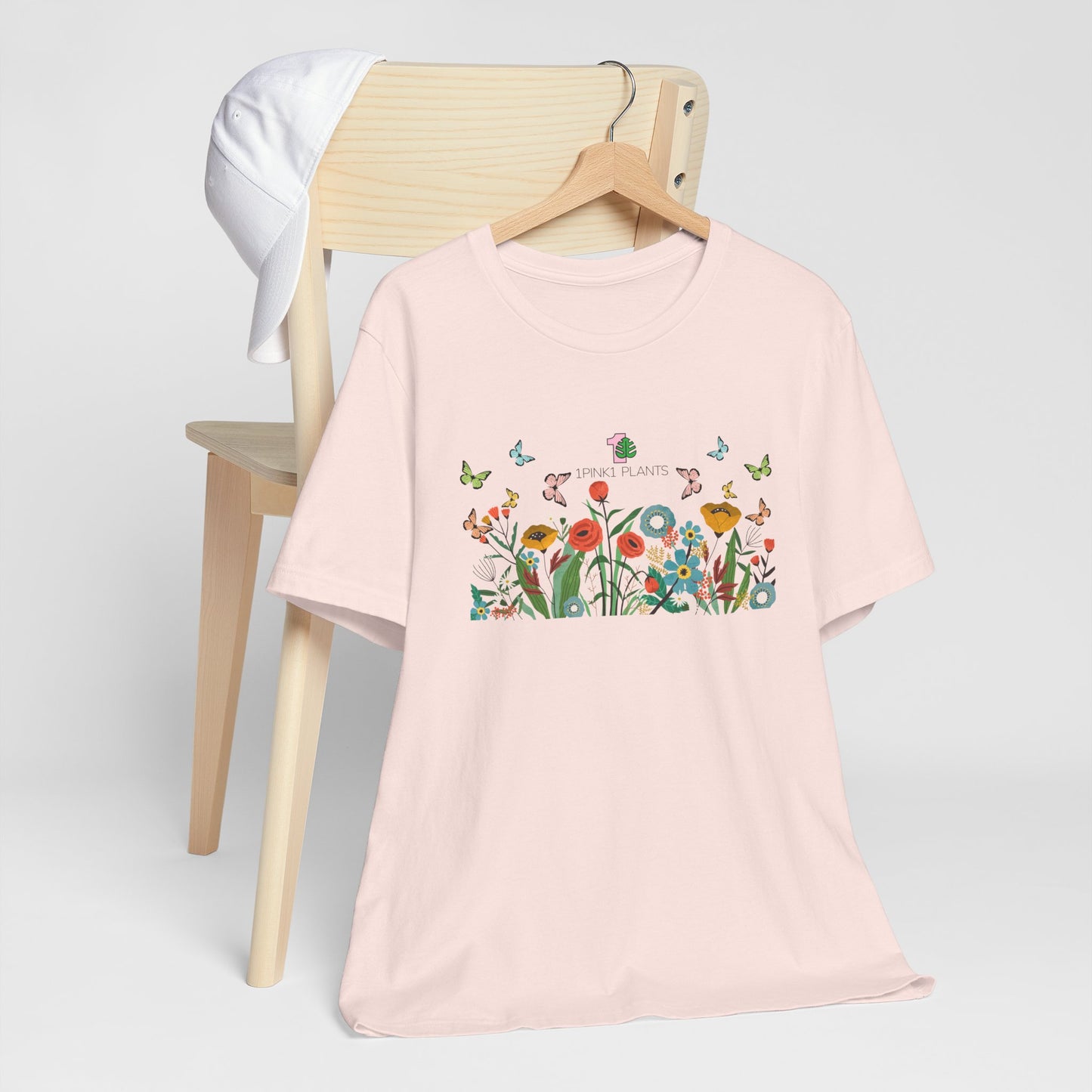 A soft pink gardening shirt for houseplant parents