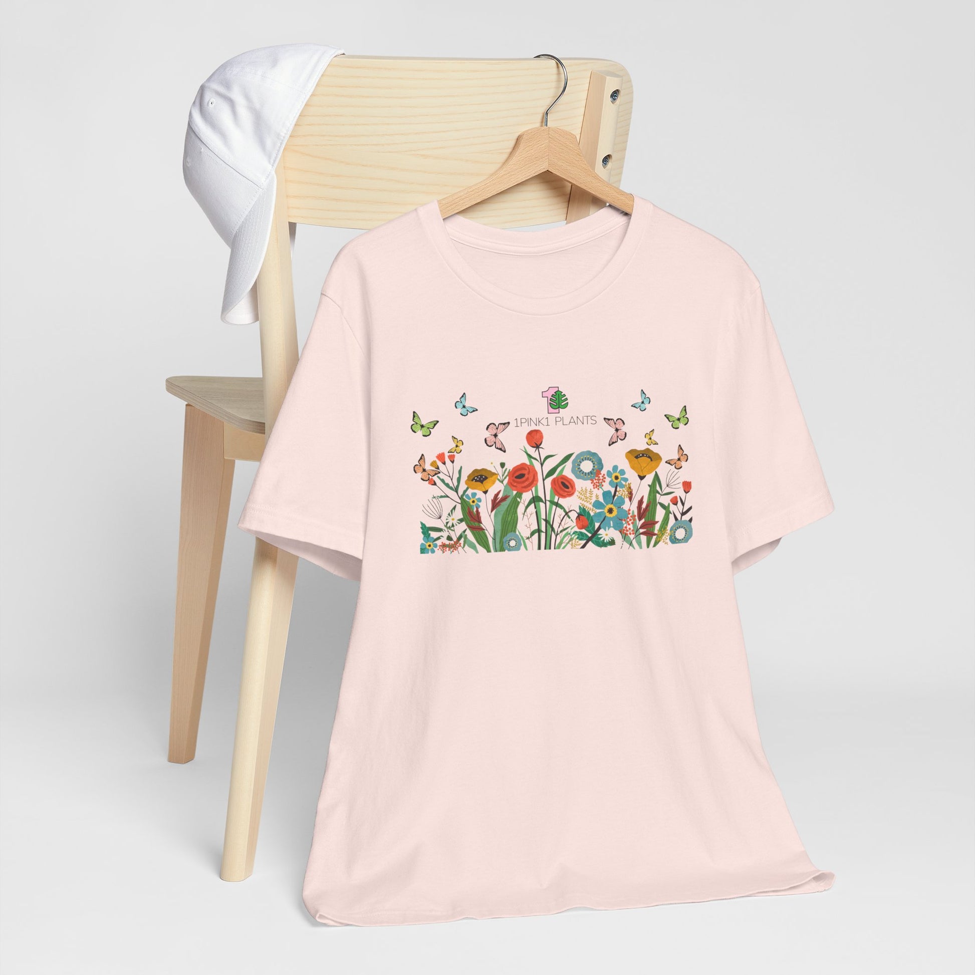 A soft pink gardening shirt for houseplant parents