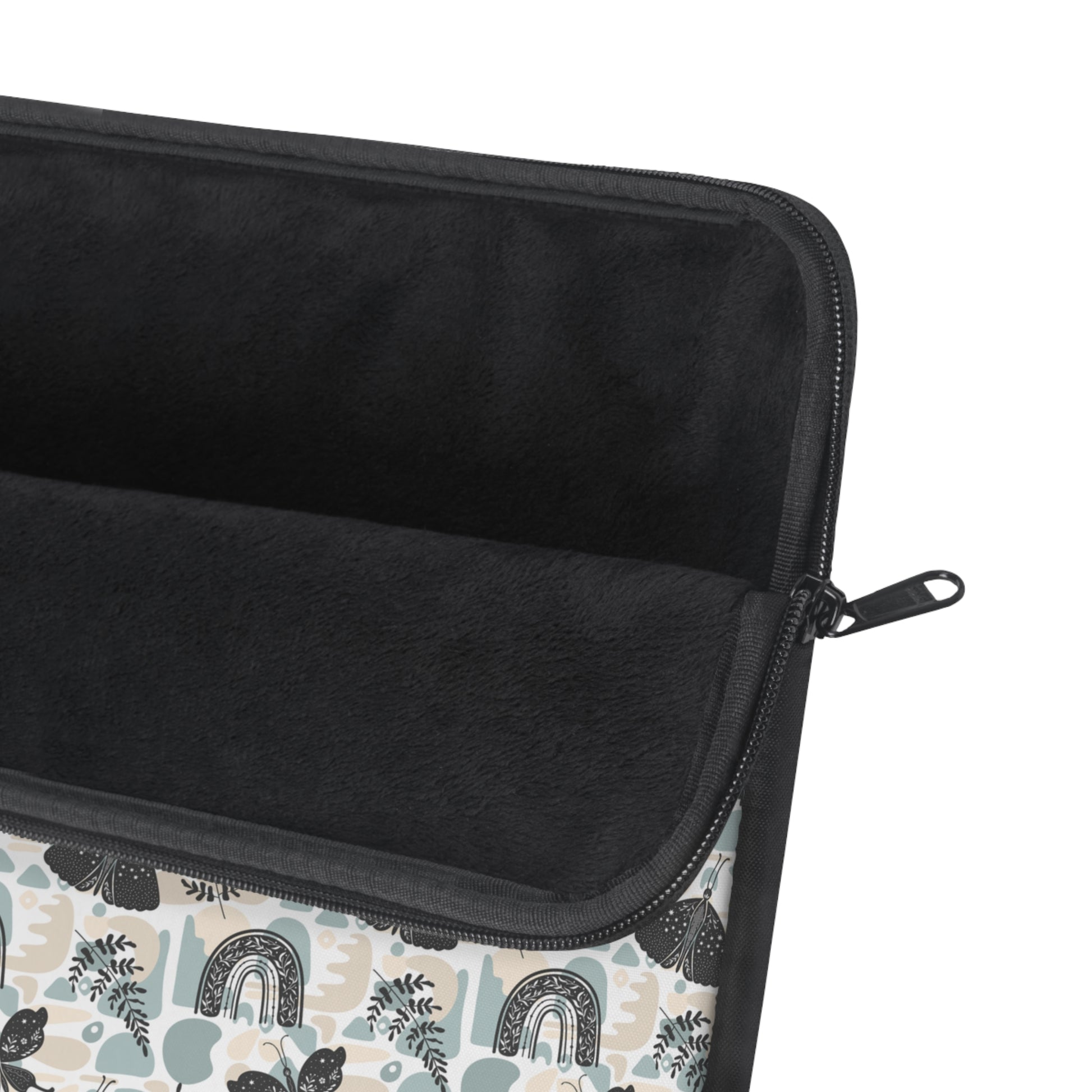 A cute boho chic style laptop sleeve with rainbows, plant leaves, and butterflies design. The padded fleece inside and black zipper can also be seen in this picture.