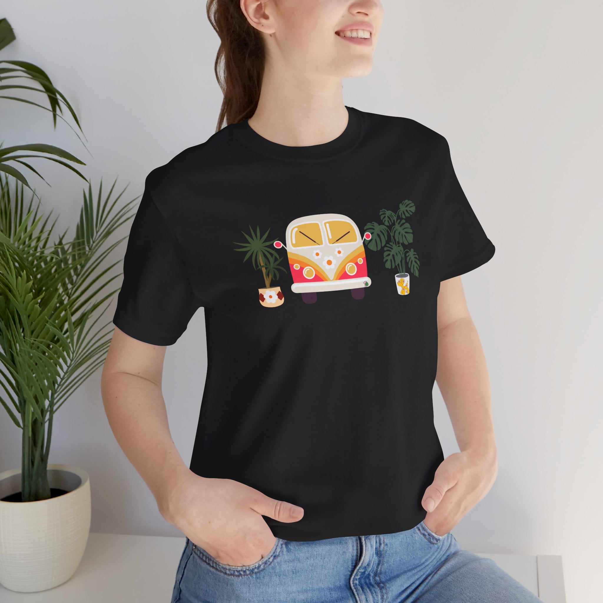 a lady wearing a plant t-shirt with houseplants design