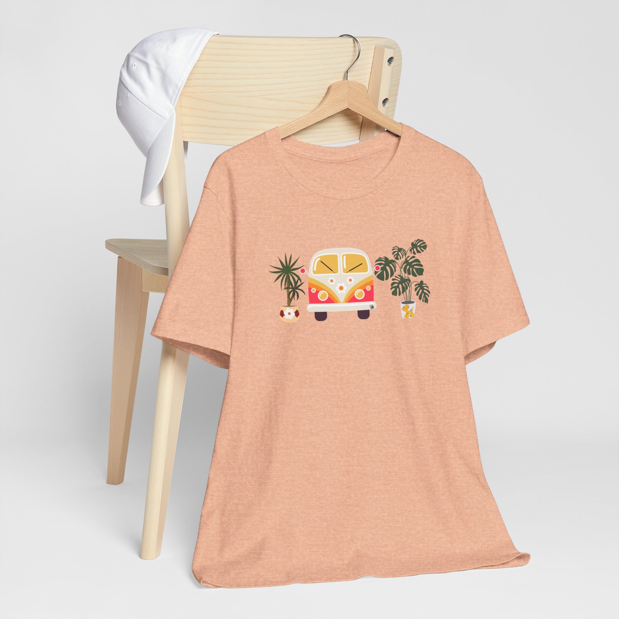 A tee shirt with plant designs and a vintage buggy car. 