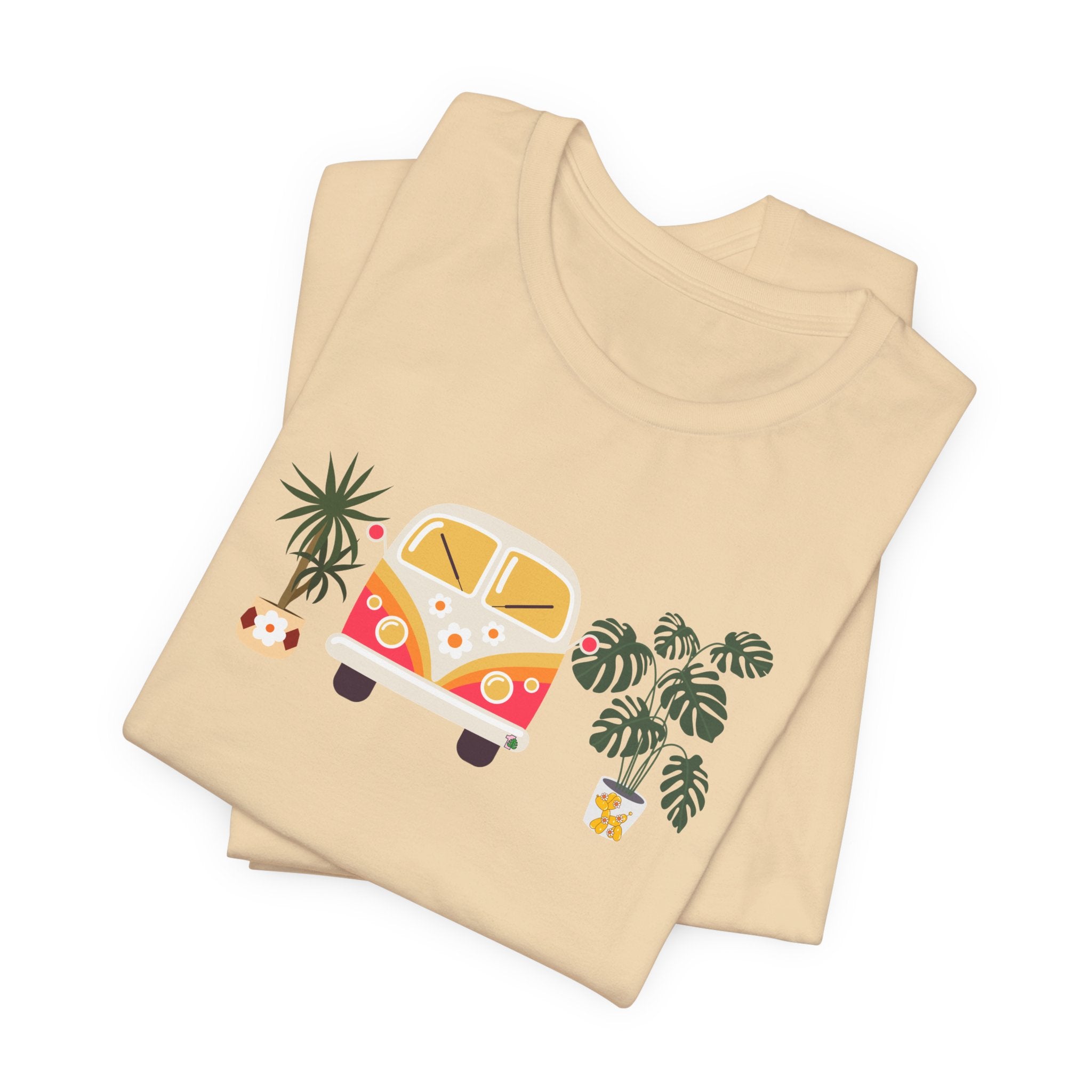 A graphic tee with plant designs and a vintage groovy bug car. 