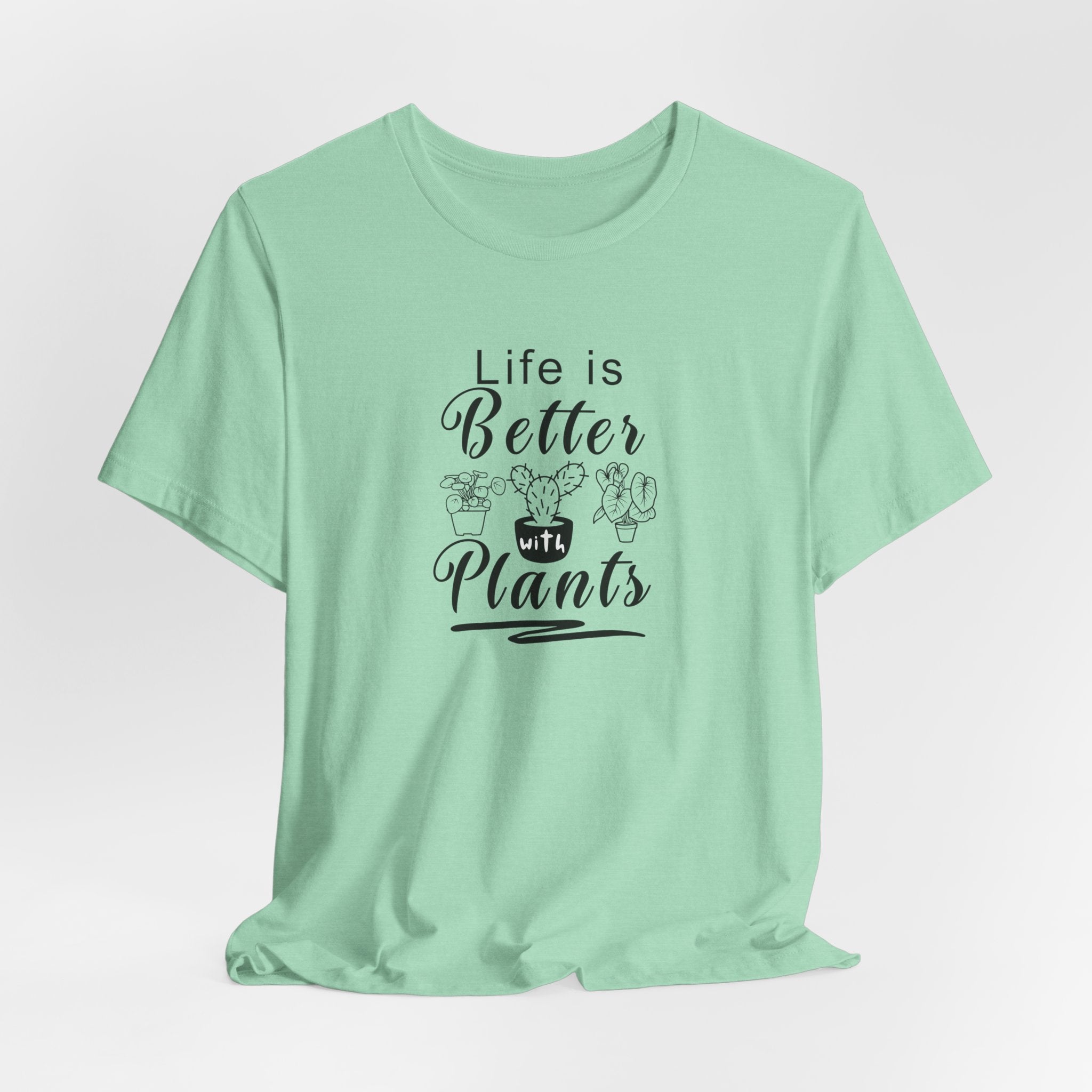 A picture of a heather mint color tee shirt with "Life is Better with Plants" text printed on the front.