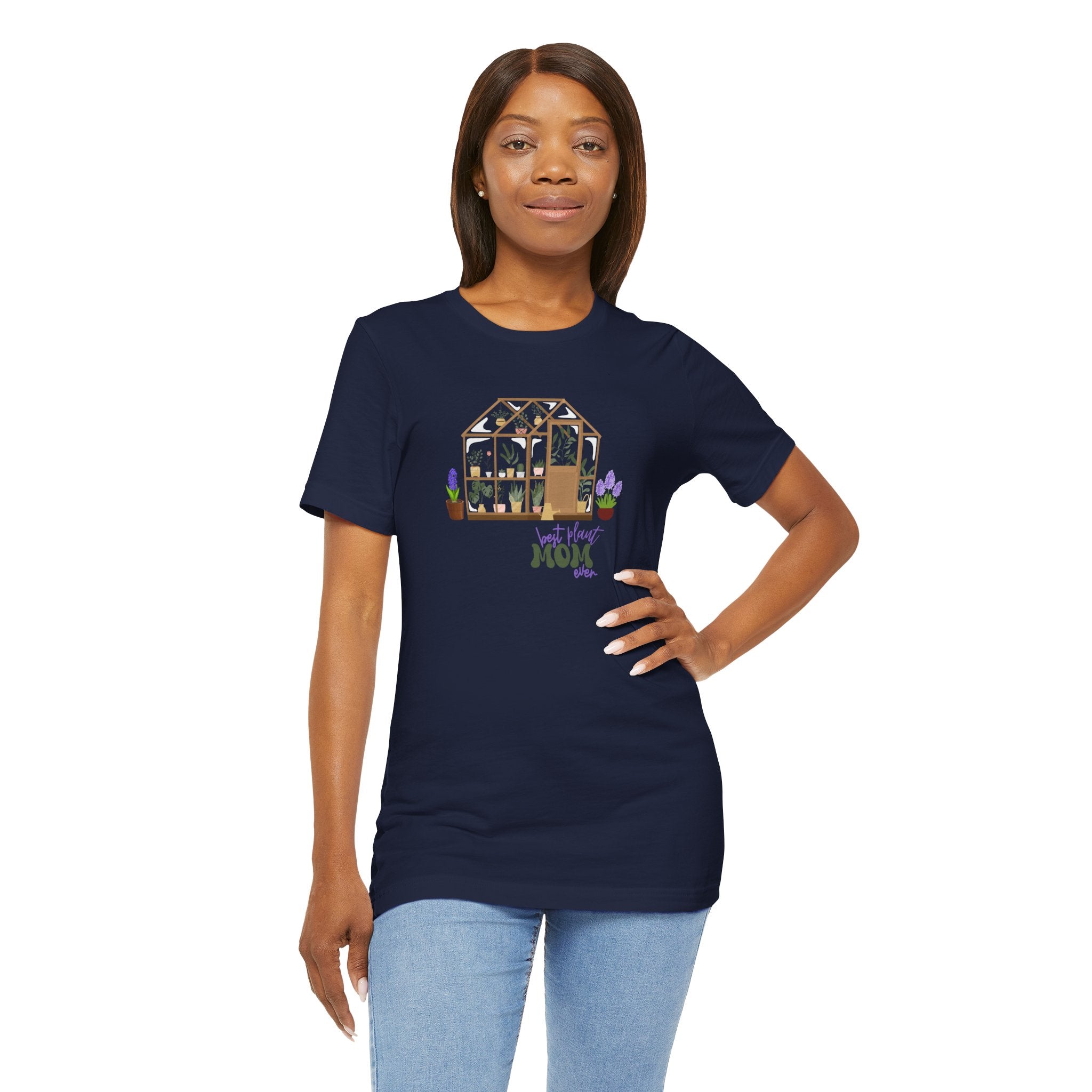 a person wearing a navy shirt with a greenhouse design and the words "best plant mom ever."  