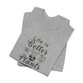 a folded gray shirt with "Life is Better with Plants" text in black  