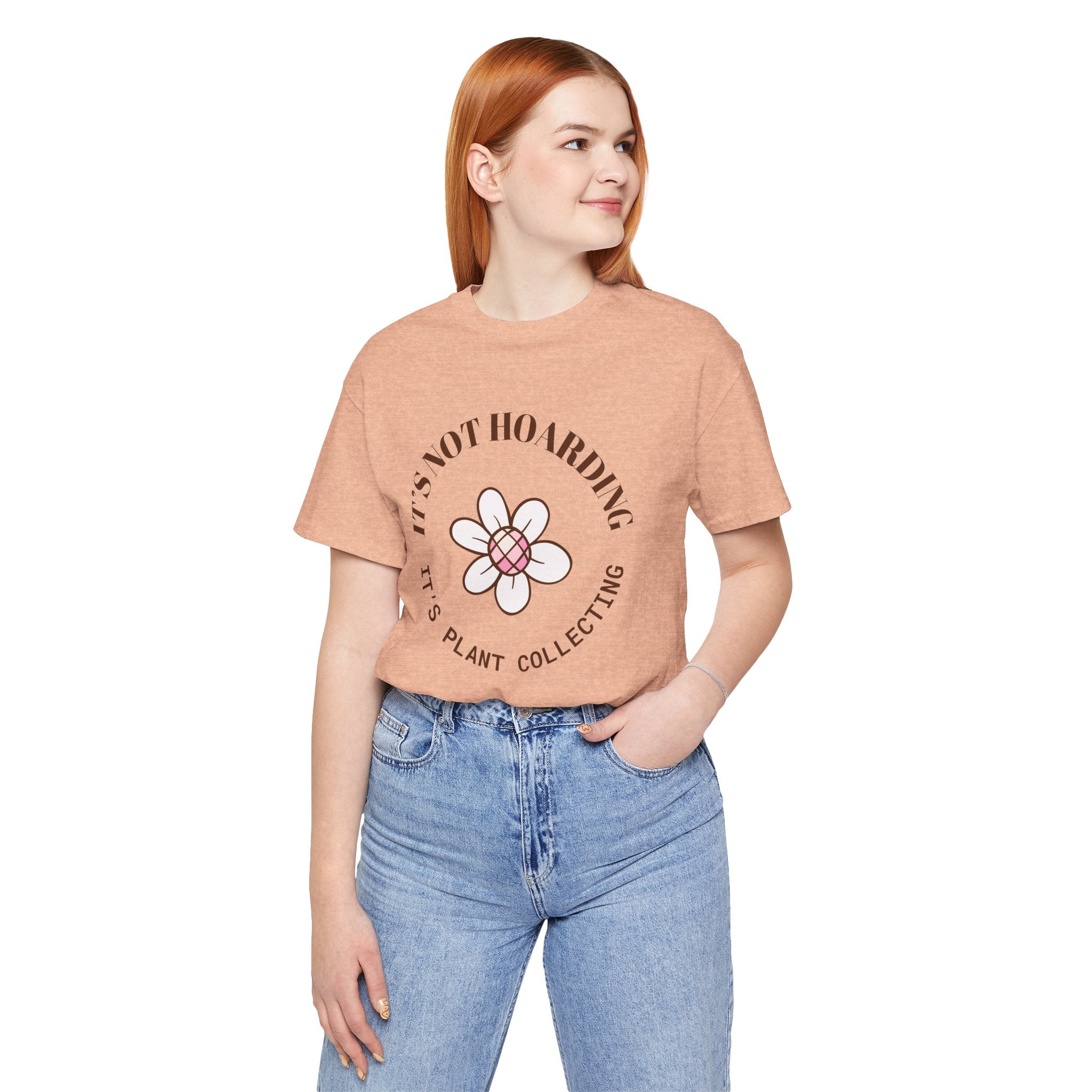 A woman wearing a shirt with text that says "It's not hoarding, it's plant collecting"