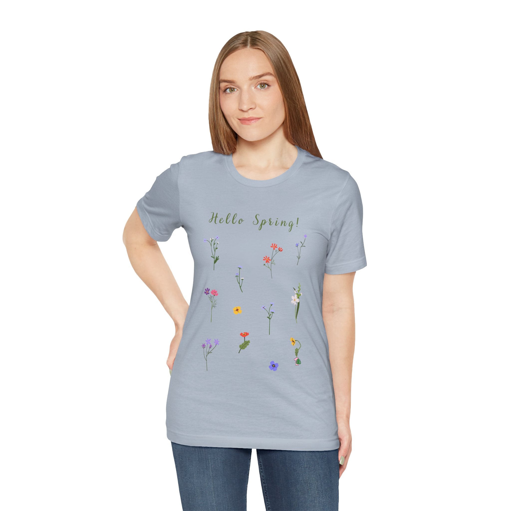 a woman wearing a shirt with wild flowers print and text that reads "Hello Spring!" 