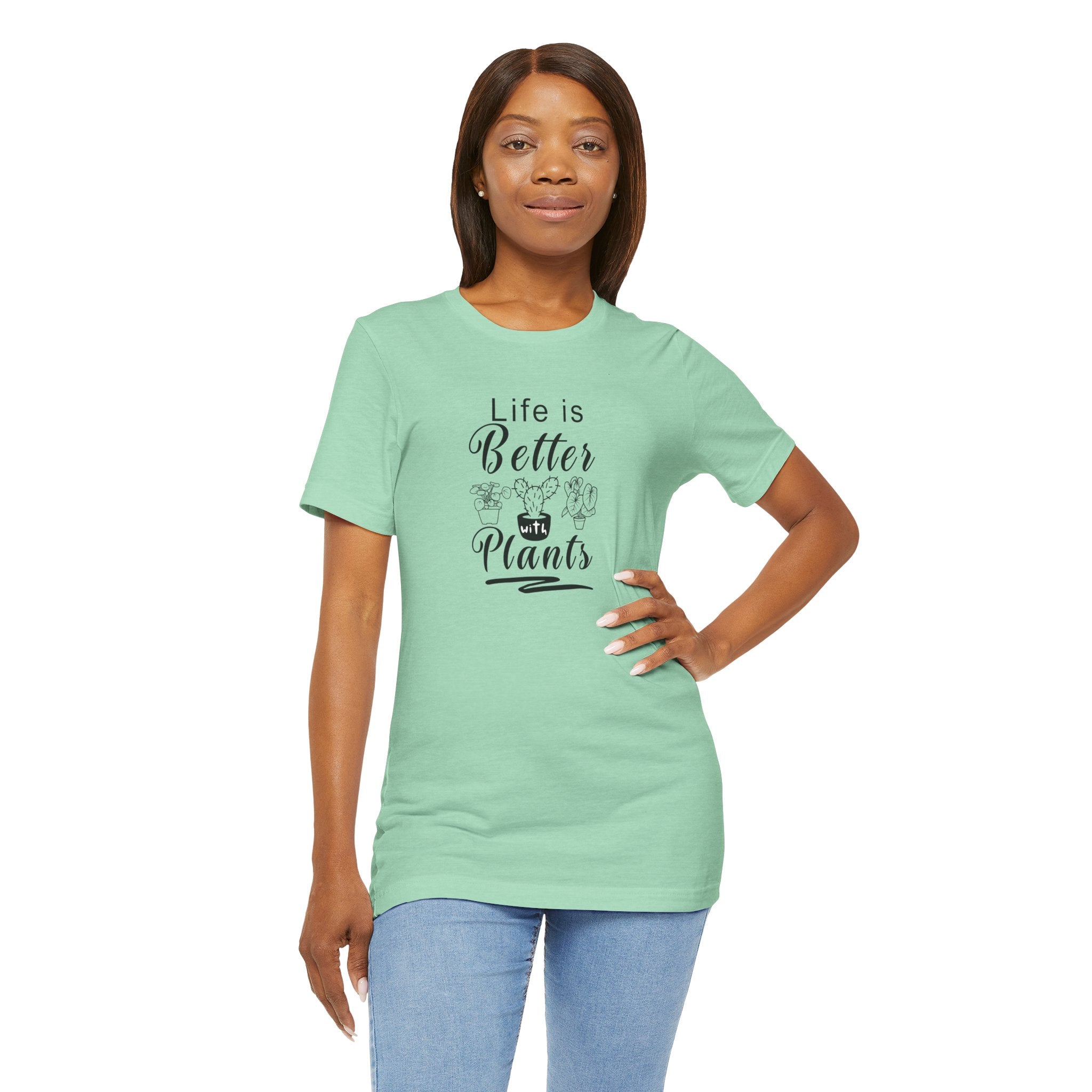 A picture of a person wearing a heather mint color tee shirt with "Life is Better with Plants" text printed on the front.
