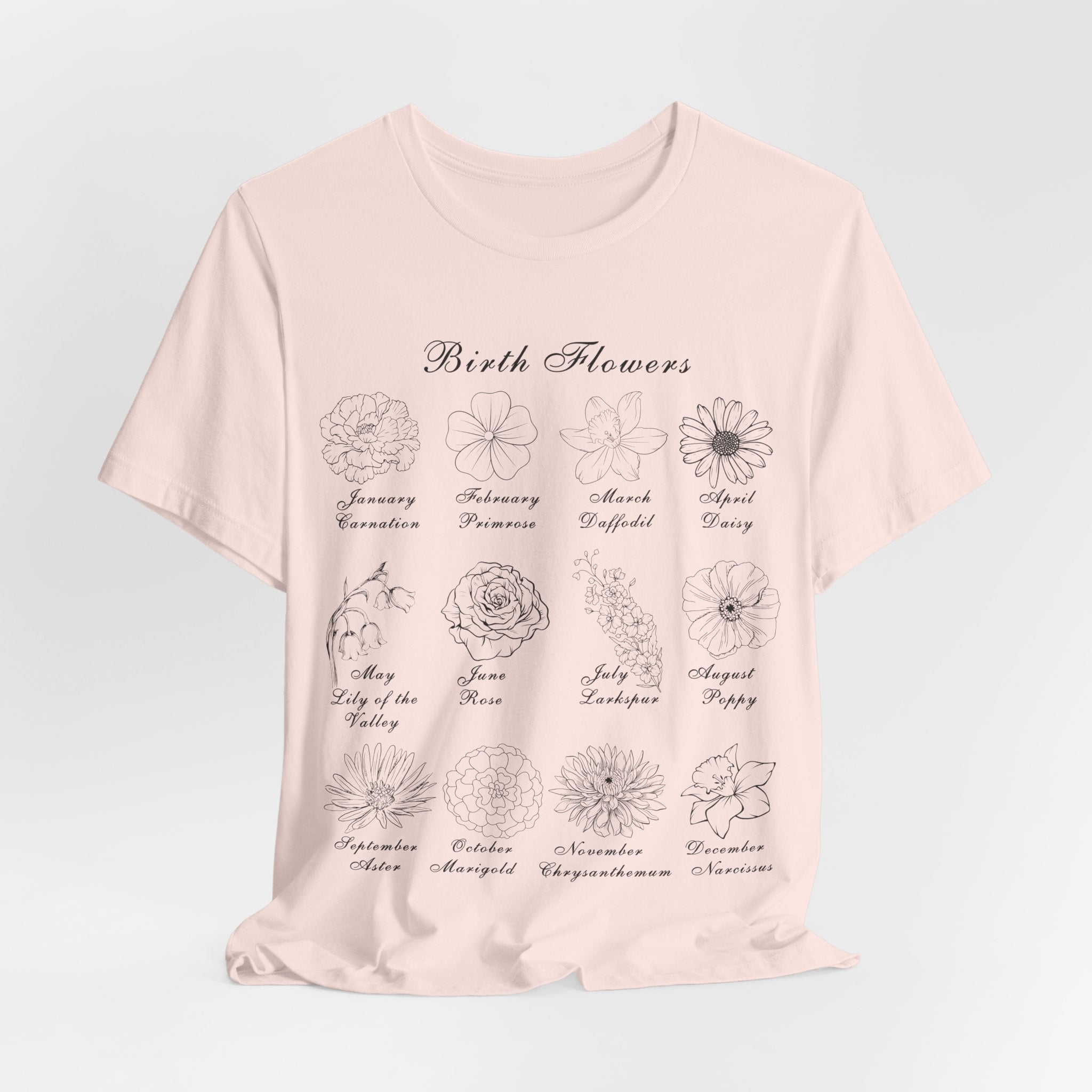 A soft pink colored shirt with a printed design of birth flowers.  Each month of the year is printed with a corresponding flower for that particular month.  The t-shirt has a crew neck and short sleeves.  It is also lightweight so it's perfect for layering.  It also makes an excellent birthday, Mother's Day, Valentine's Day or Christmas gift. 