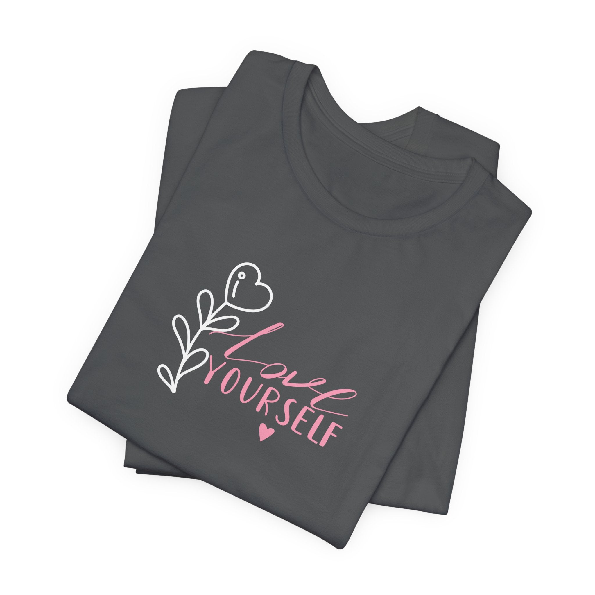 Picture of folded Asphalt colored tshirt with pink text that says "love yourself".  
