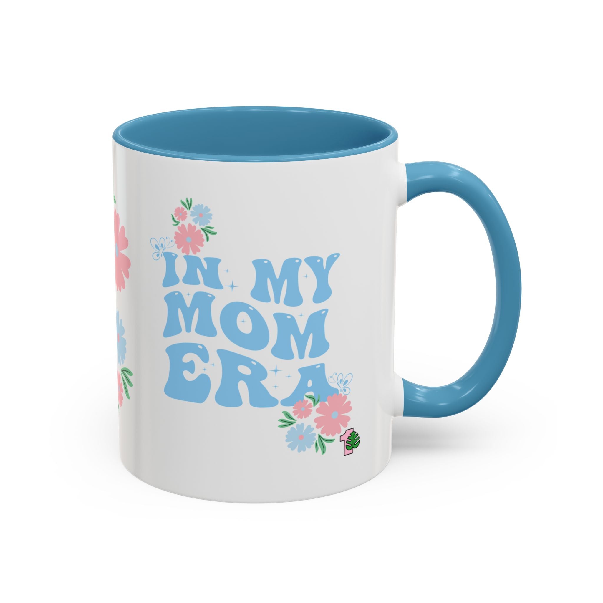 Mug with 'In My Mom Era' text and floral designs on a white background