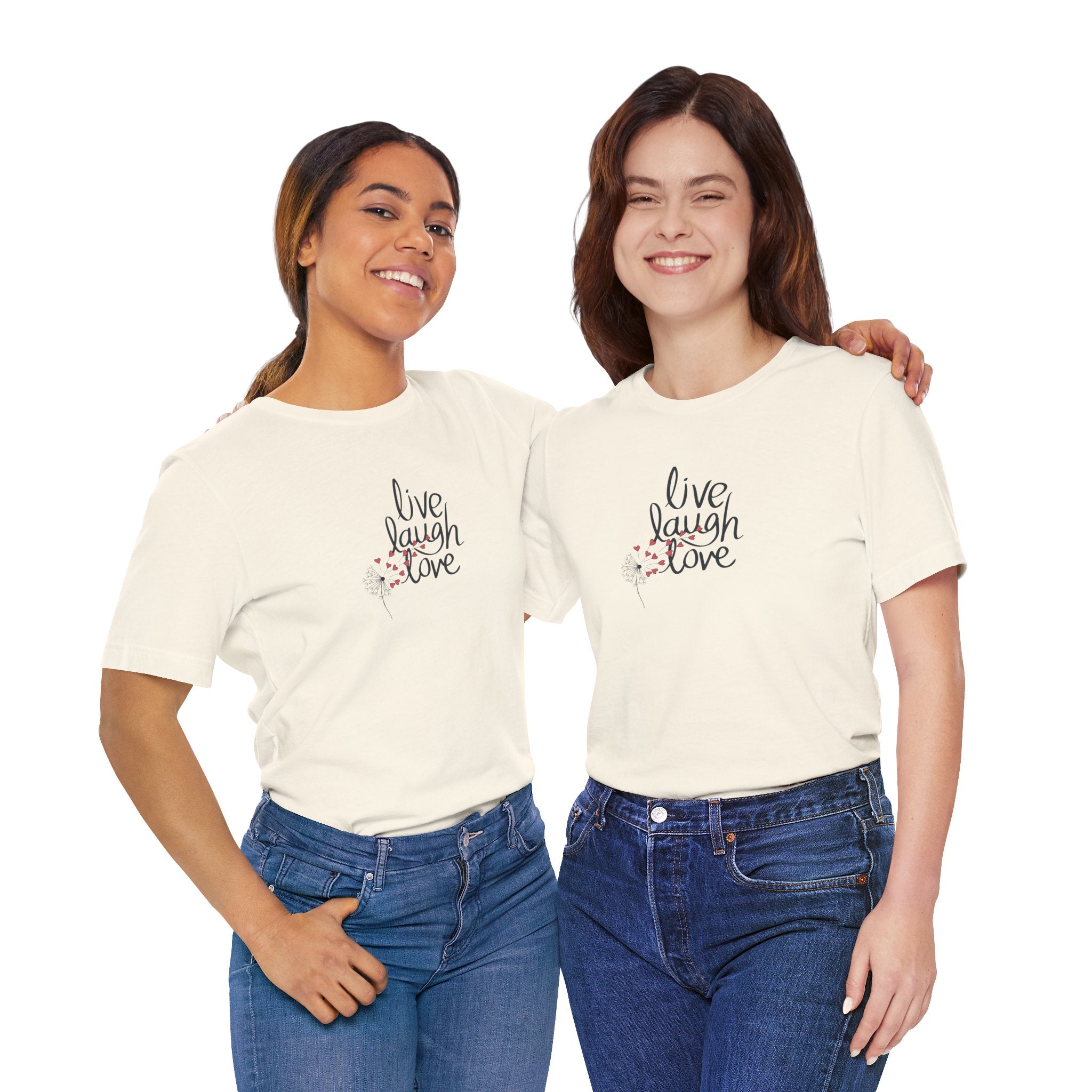 Two young women wearing a tee with text that says "live, laugh, love," and a dandelion with hearts.