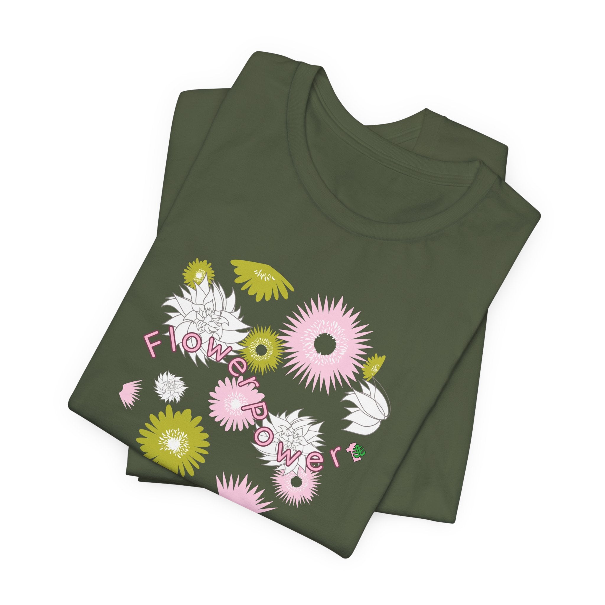 A folded military green color tee shirt with the words flower power in pink.  There are also pink, white, and green flowers printed on the shirt. 