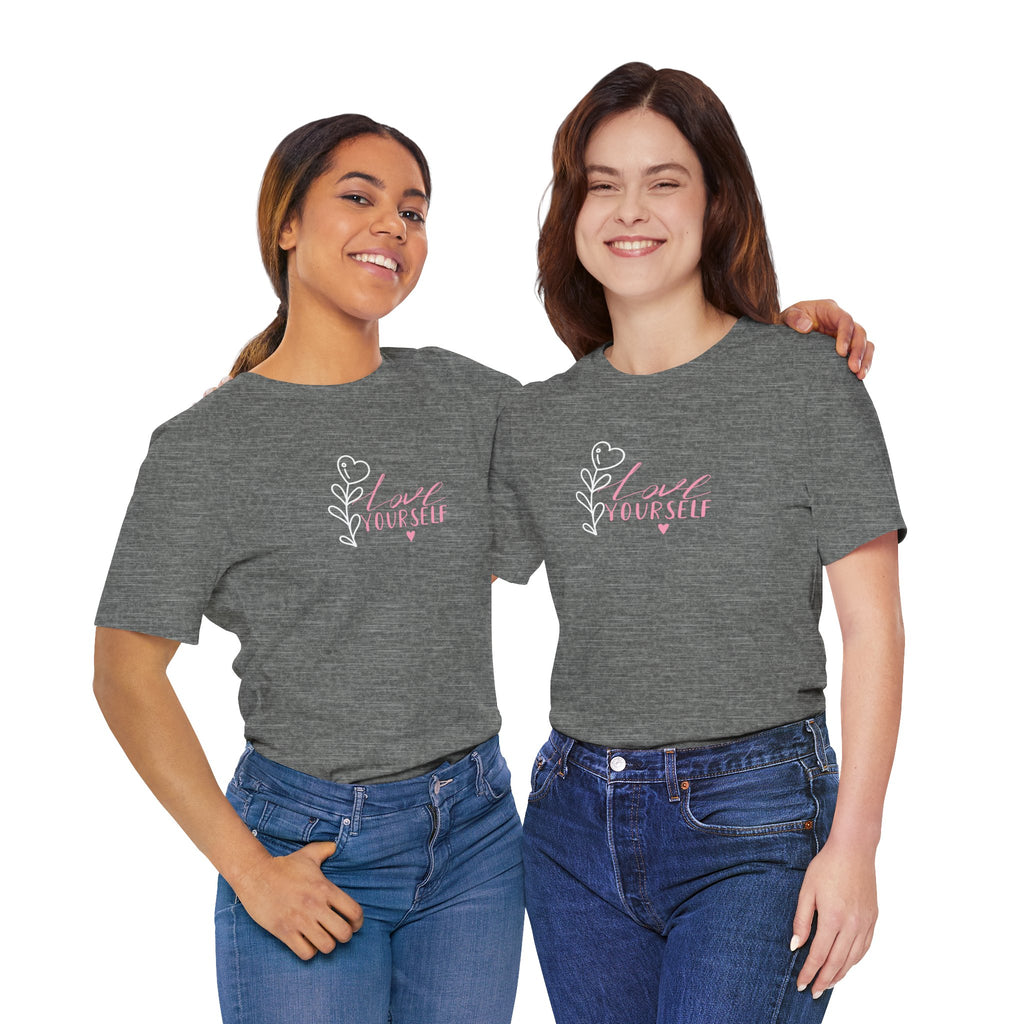 two college students wearing a gray shirt with the words "love yourself"