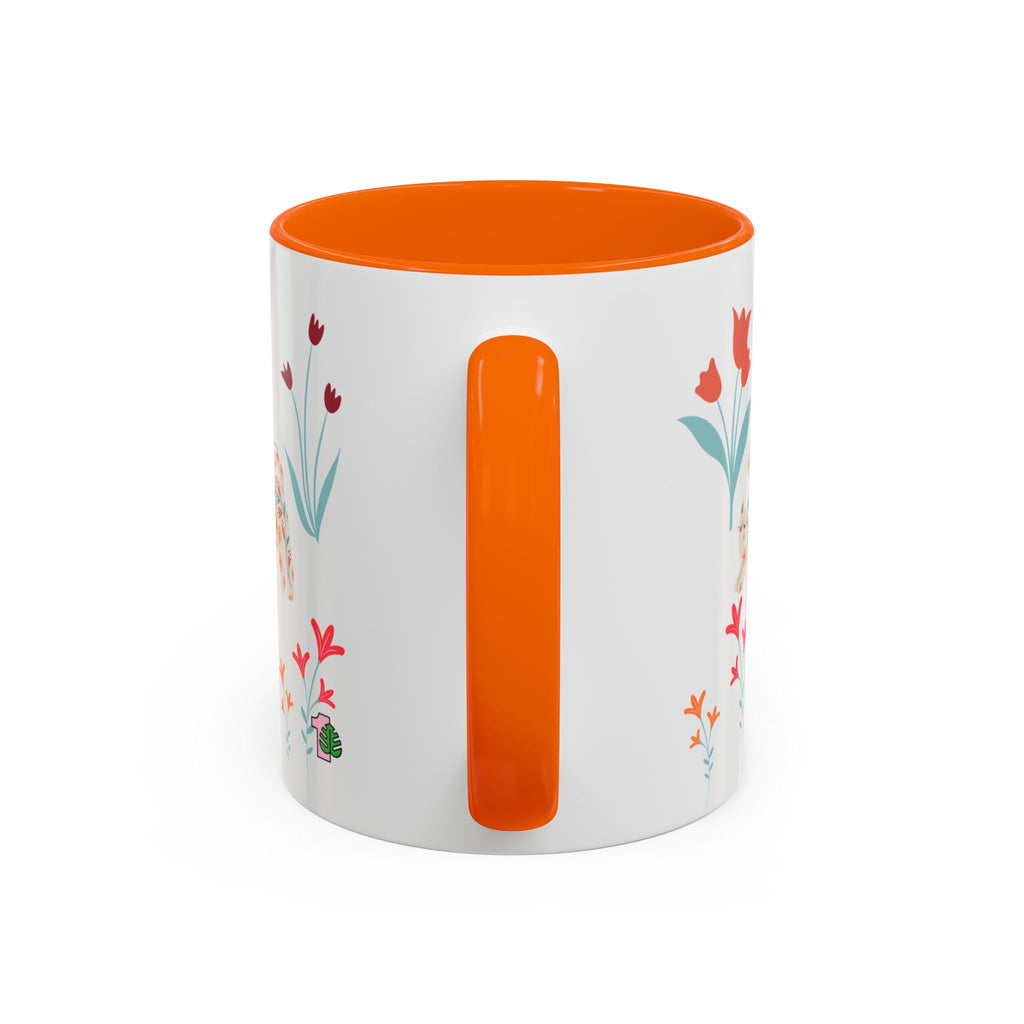 White mug with orange interior and handle, featuring floral designs on a white background
