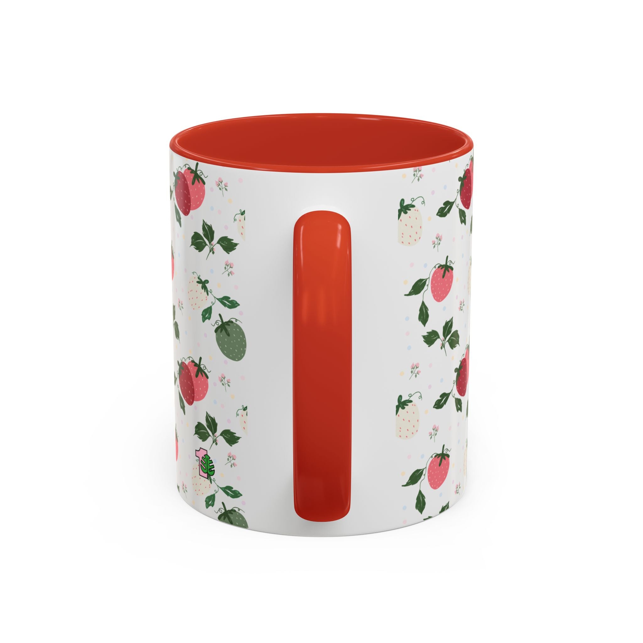 White mug with red interior and handle, featuring a floral and fruit pattern on a white background.