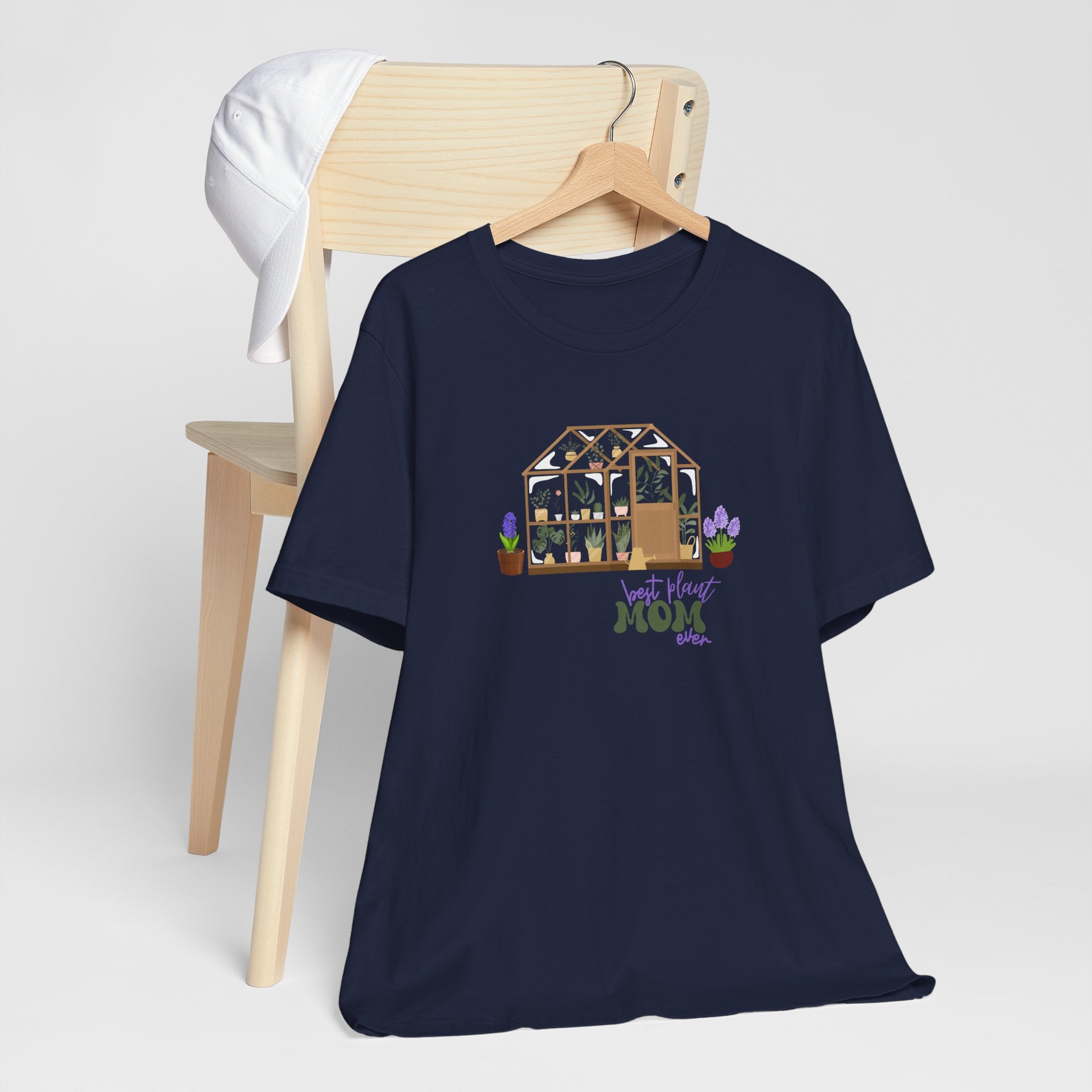 a navy shirt with a greenhouse design and the words "best plant mom ever."  