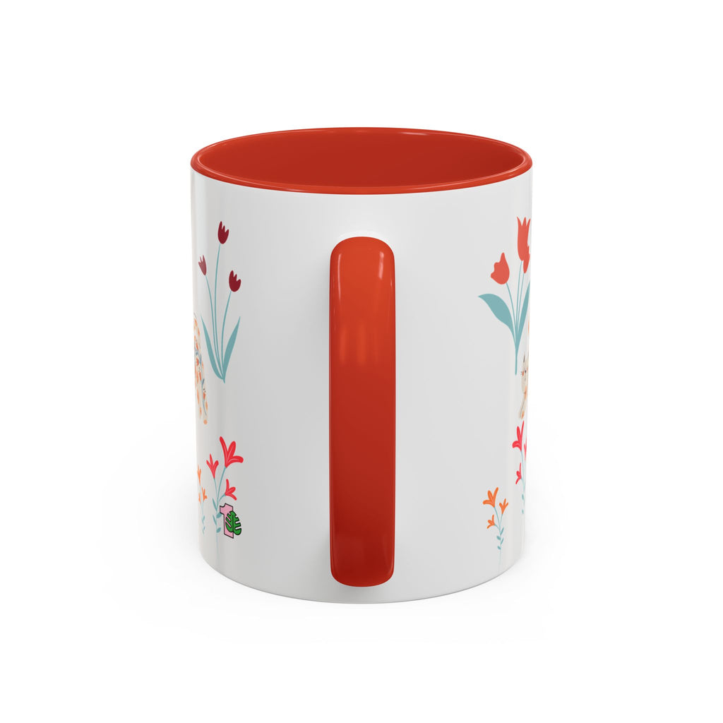 White mug with red interior and handle, featuring floral designs on a white background