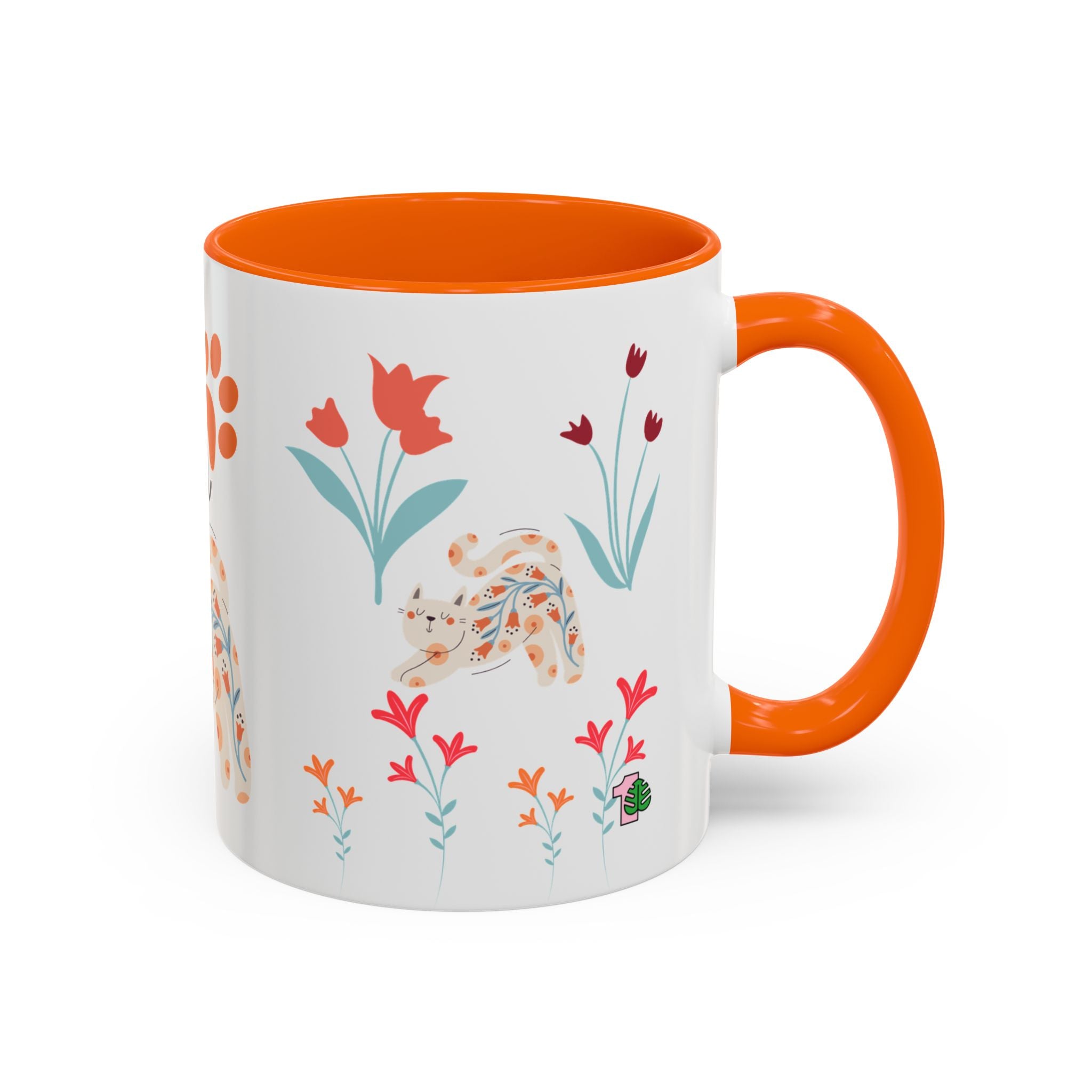 Mug with orange interior and handle, featuring floral and cat design on a white background