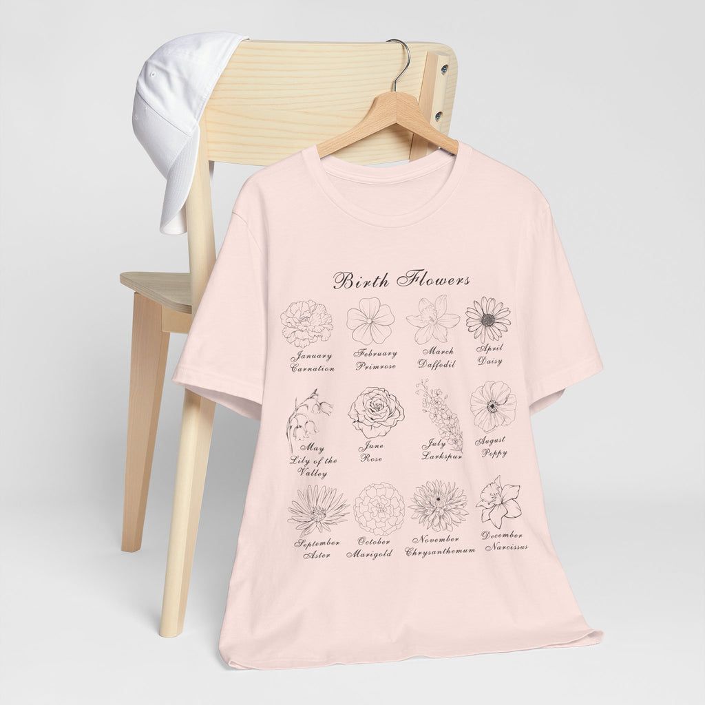 A soft pink colored tee shirt with a printed design of birth flowers.  Each month of the year is printed with a corresponding flower for that particular month.  The t-shirt has a crew neck and short sleeves.  It is also lightweight so it's perfect for layering.  It also makes an excellent birthday, Mother's Day, Valentine's Day or Christmas gift. 