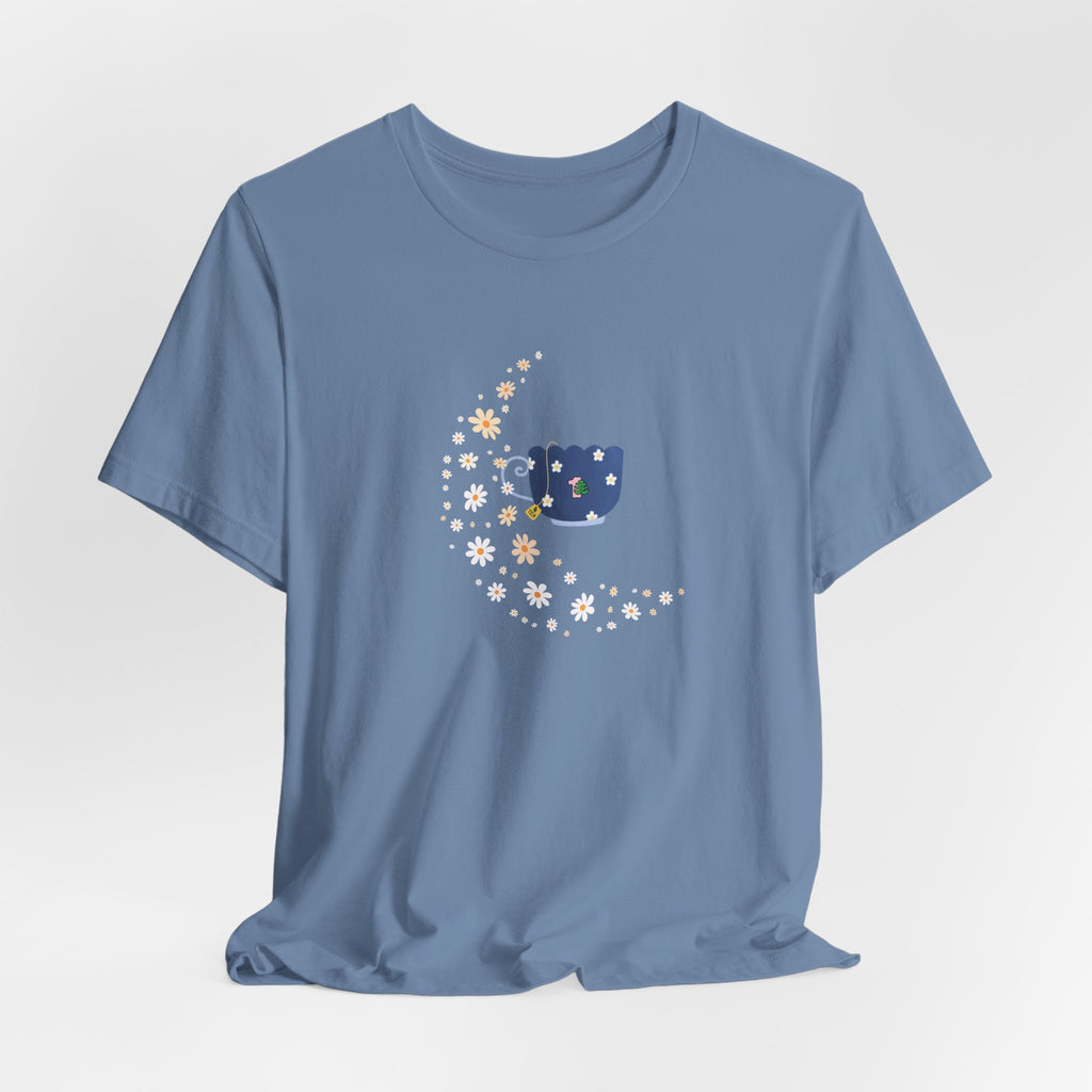 A steel blue colored tee-shirt featuring a floral moon and a teacup design.  It has a crew neck and short sleeves.  