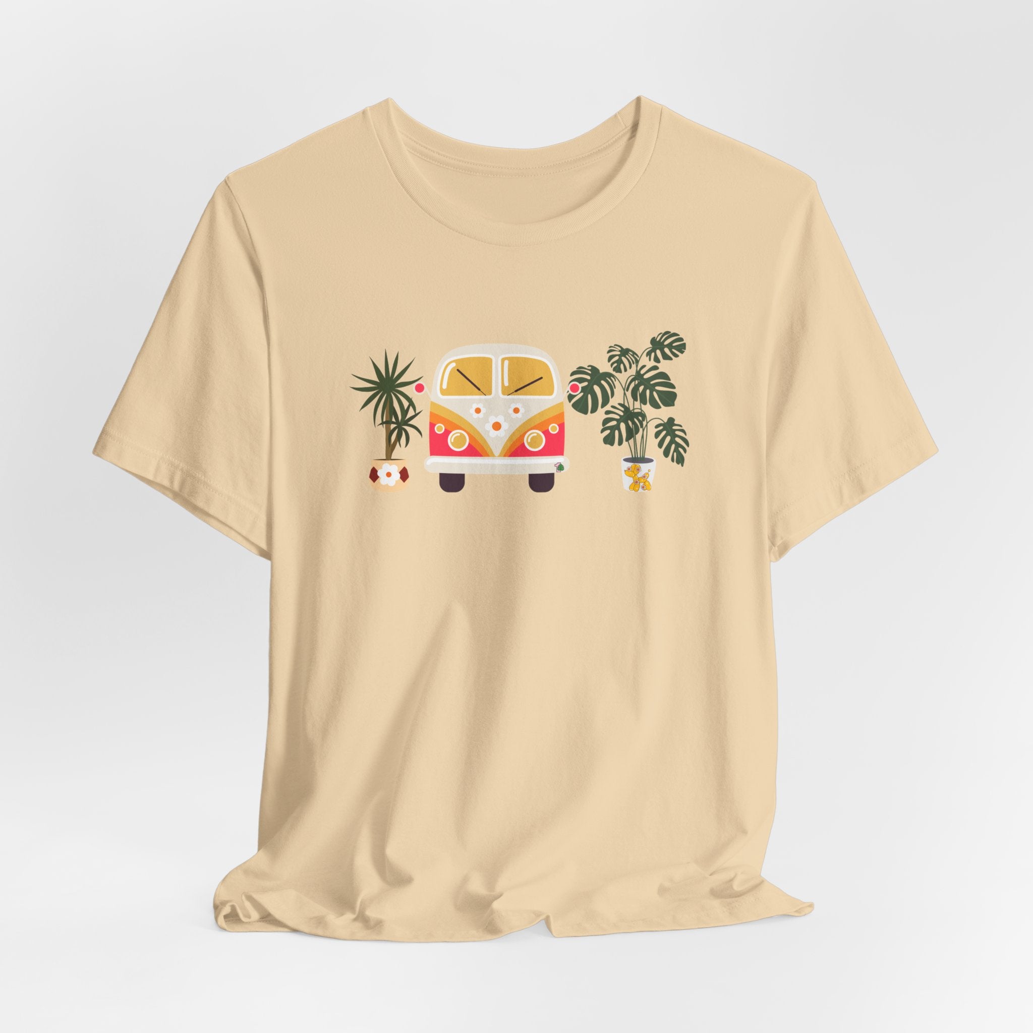 A top with plant designs and a vintage groovy bug car. 