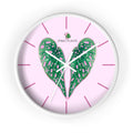 Wall clock with green begonia leaf design and pink background, featuring the brand 'iPINKI PLANTS'.