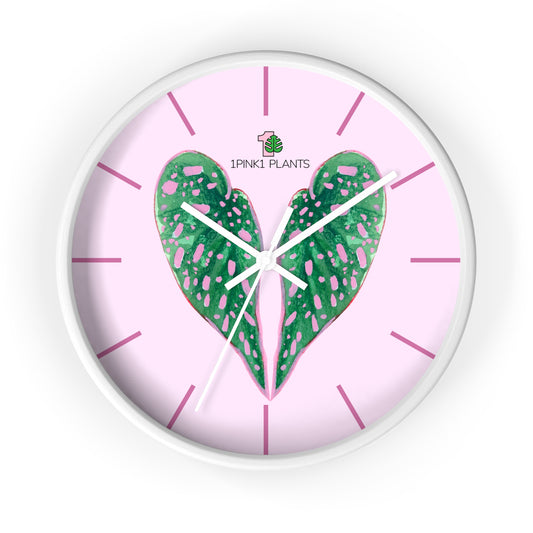 Wall clock with green begonia leaf design and pink background, featuring the brand 'iPINKI PLANTS'.