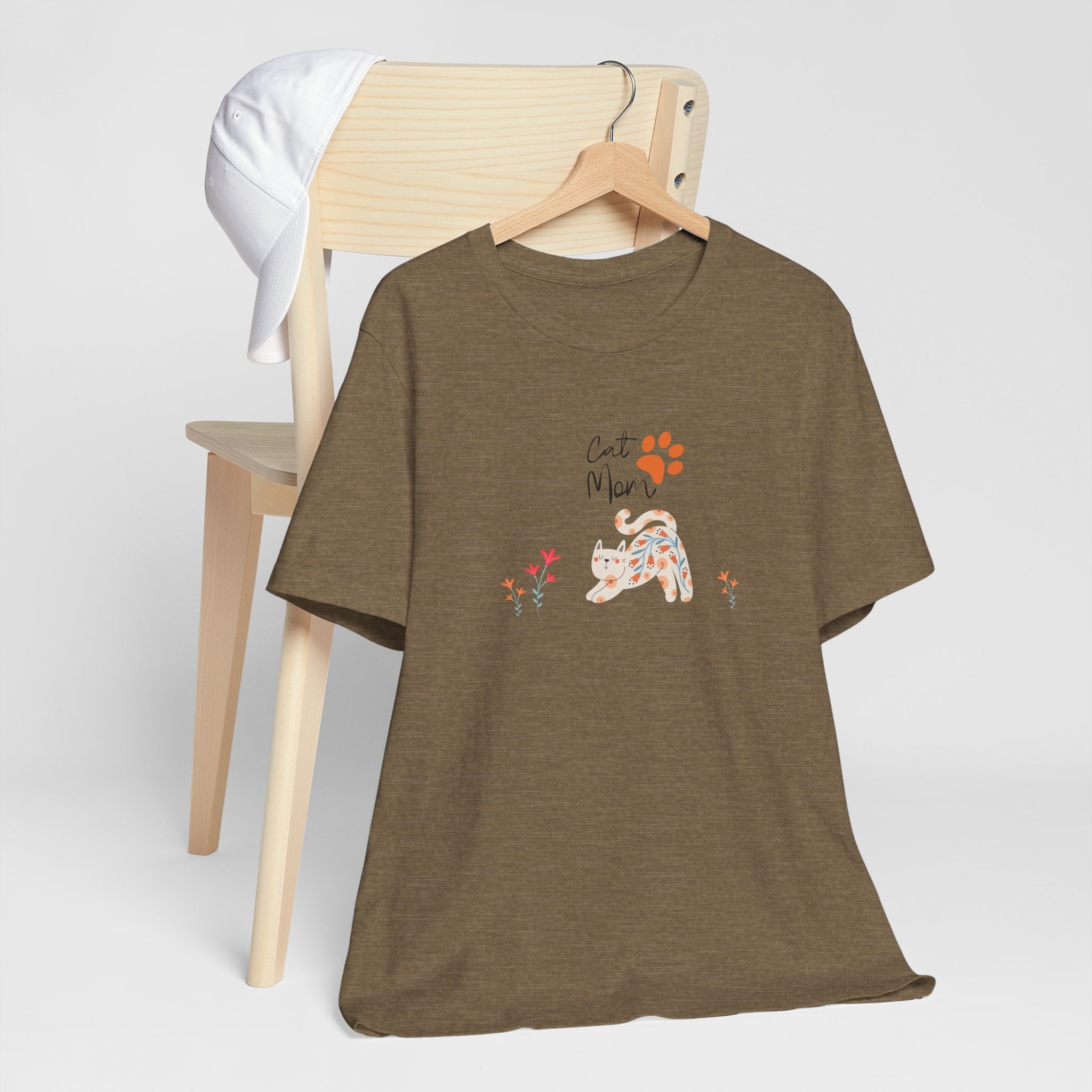 a heather olive t-shirt with the words "cat mom," a floral cat, and some flowers.