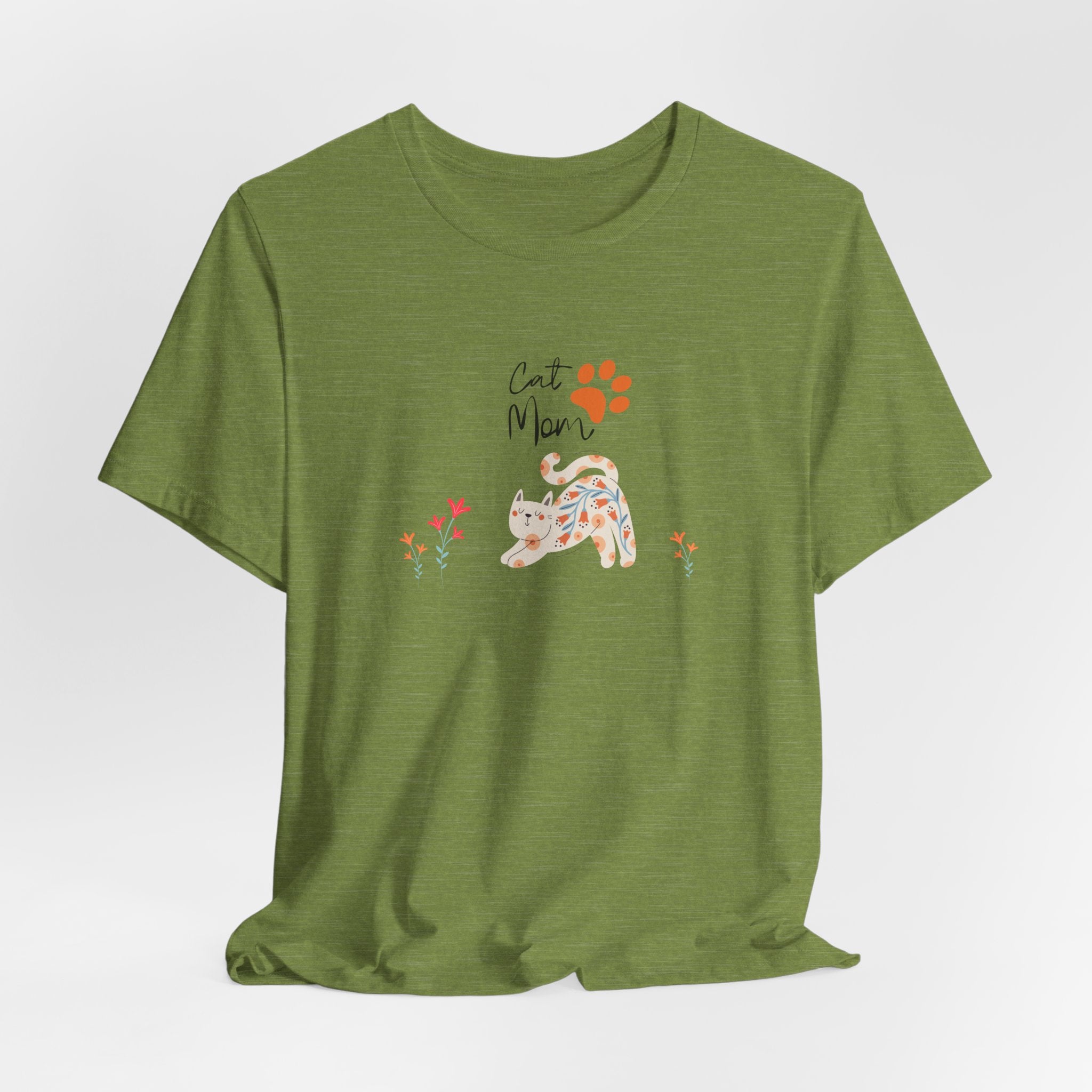 A heather green t-shirt with the words "cat mom," a floral cat, and some flowers printed on the front of the shirt.