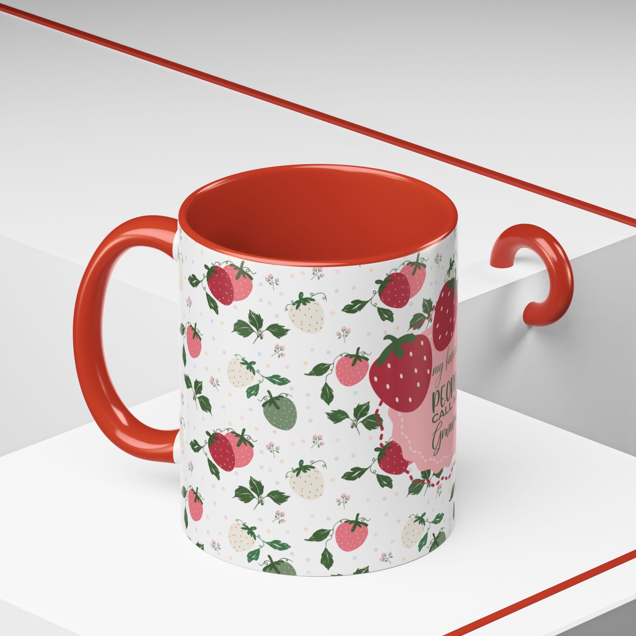 Mug with strawberry pattern and red interior on a white background