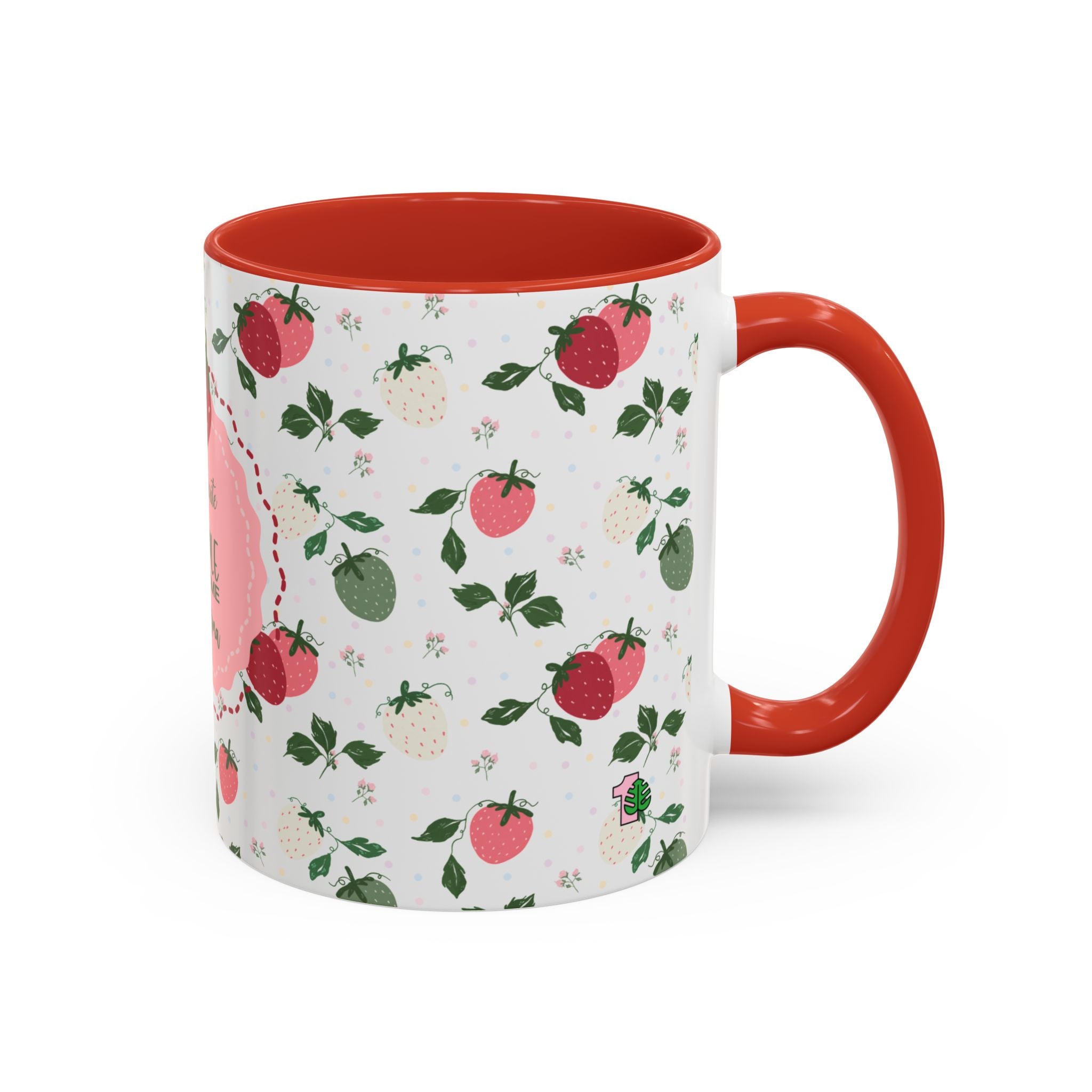 Mug with red interior and handle, featuring a strawberry pattern on a white background