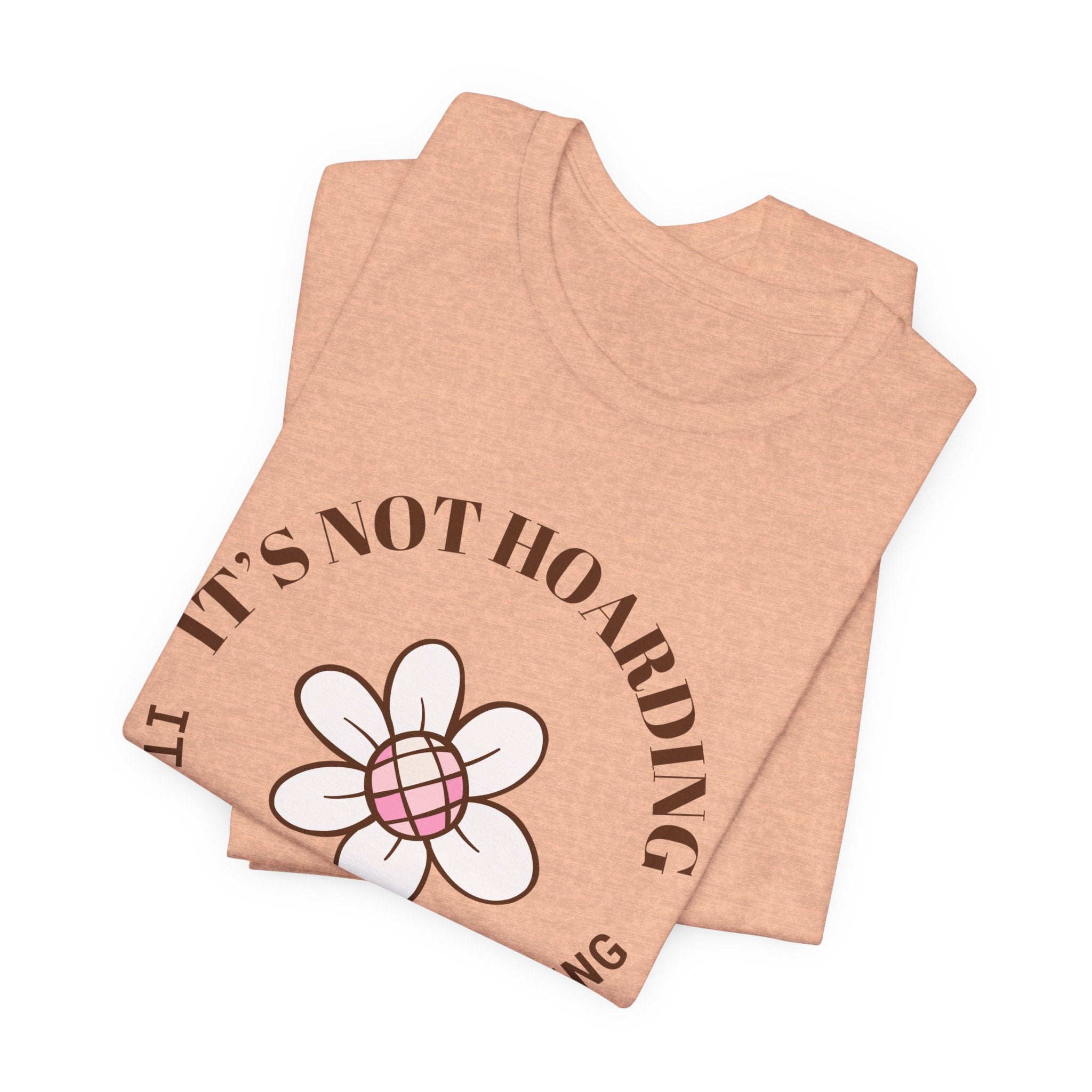 a folded tshirt with text that says "It's not hoarding, it's plant collecting"