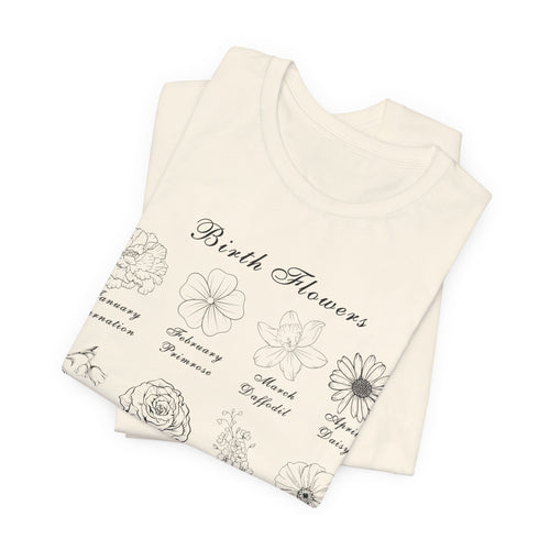 A folded tshirt in a natural colored tone and a printed design of birth flowers.  Each month of the year is printed with a corresponding flower for that particular month.  The t-shirt has a crew neck and short sleeves.  It is also lightweight so it's perfect for layering.  It also makes an excellent birthday, Mother's Day, Valentine's Day or Christmas gift. 