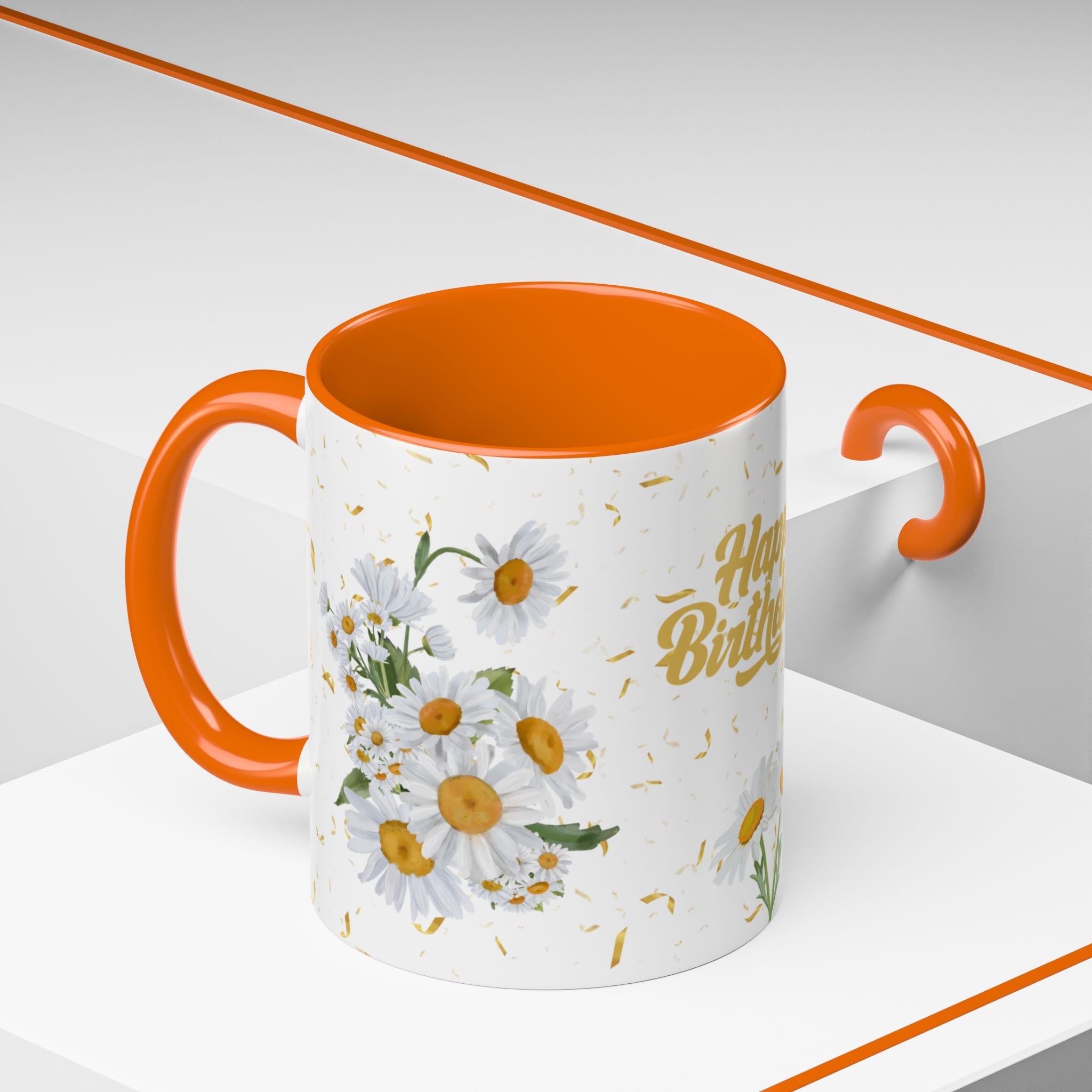Mug with orange interior and handle, featuring floral design and 'Happy Birthday' text on a white background.